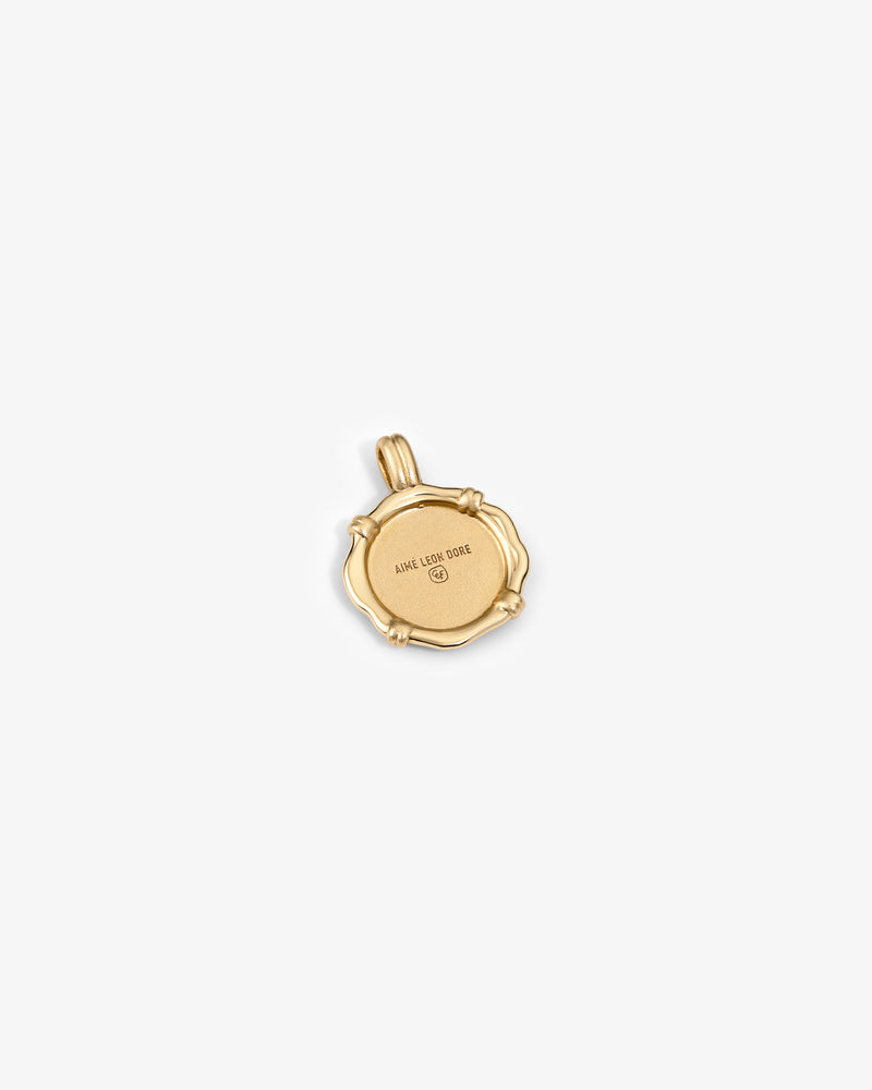 14Kt Gold Coin Pendant with scalloped edge and engraved "AMOR LUX ORDE" on a plain white background.