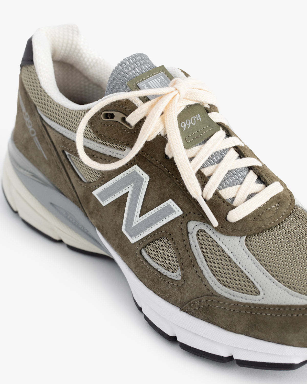 Olive green and gray ALD / New Balance 990v4 with white laces, mesh panels, and a white-gray sole.