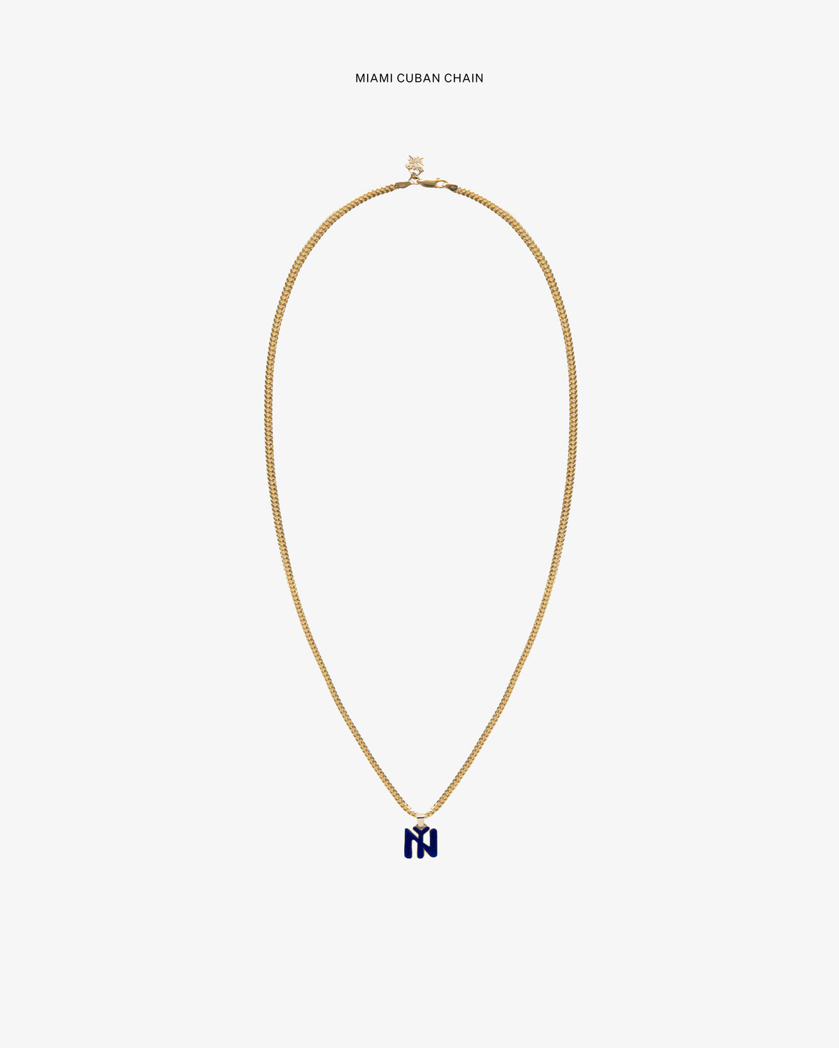 14Kt Gold Pendant with blue stone on a white background.