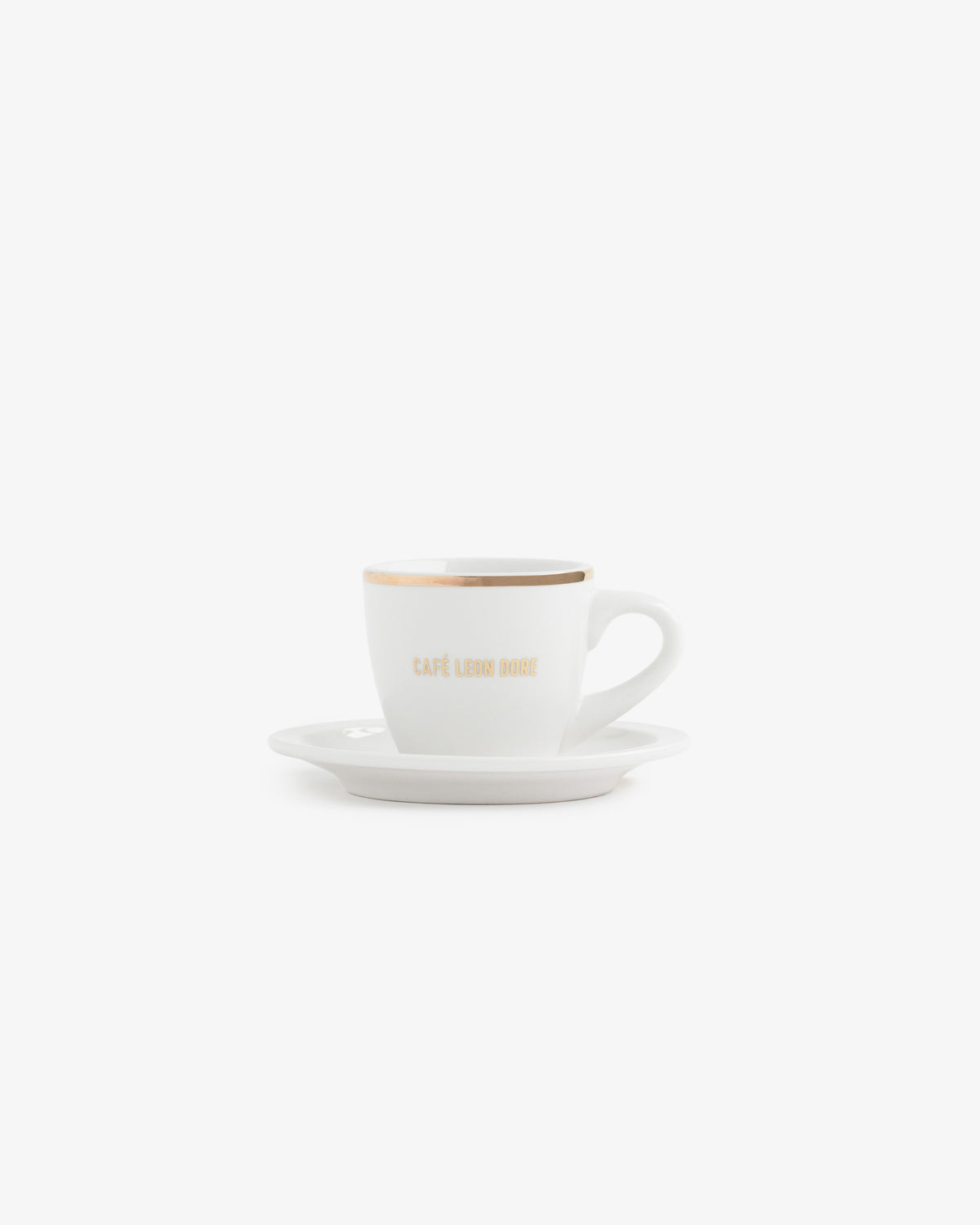 Café Leon Dore Espresso Cup with gold rim on matching saucer, shown on a white background.