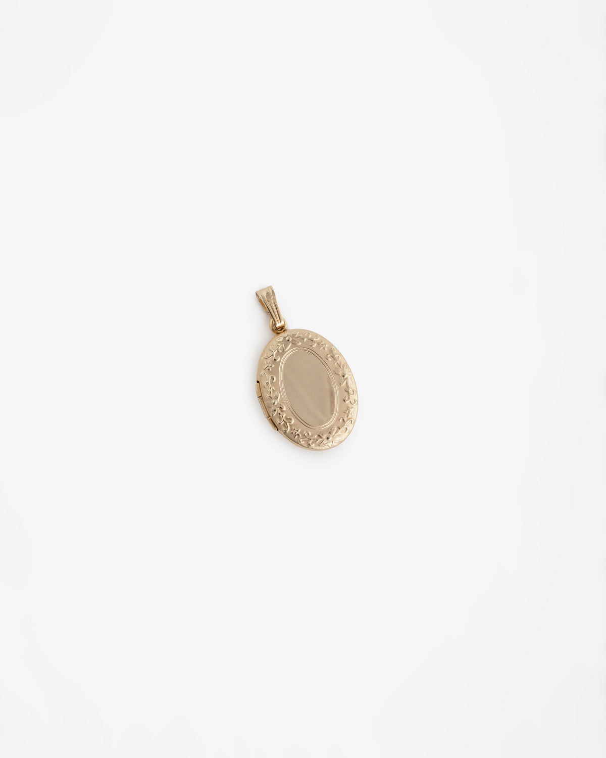14Kt gold oval locket pendant with a floral border, shown on a plain white background.