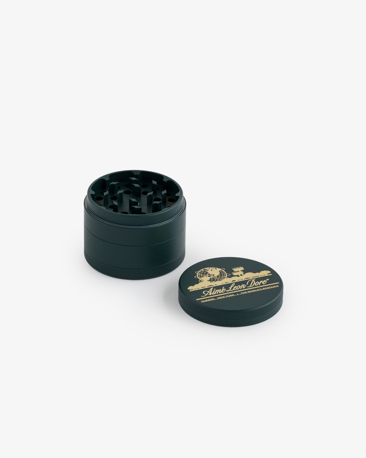 The Large Unisphere Herb Grinder is a black metal grinder with an open top and gold logo, shown on a white background.