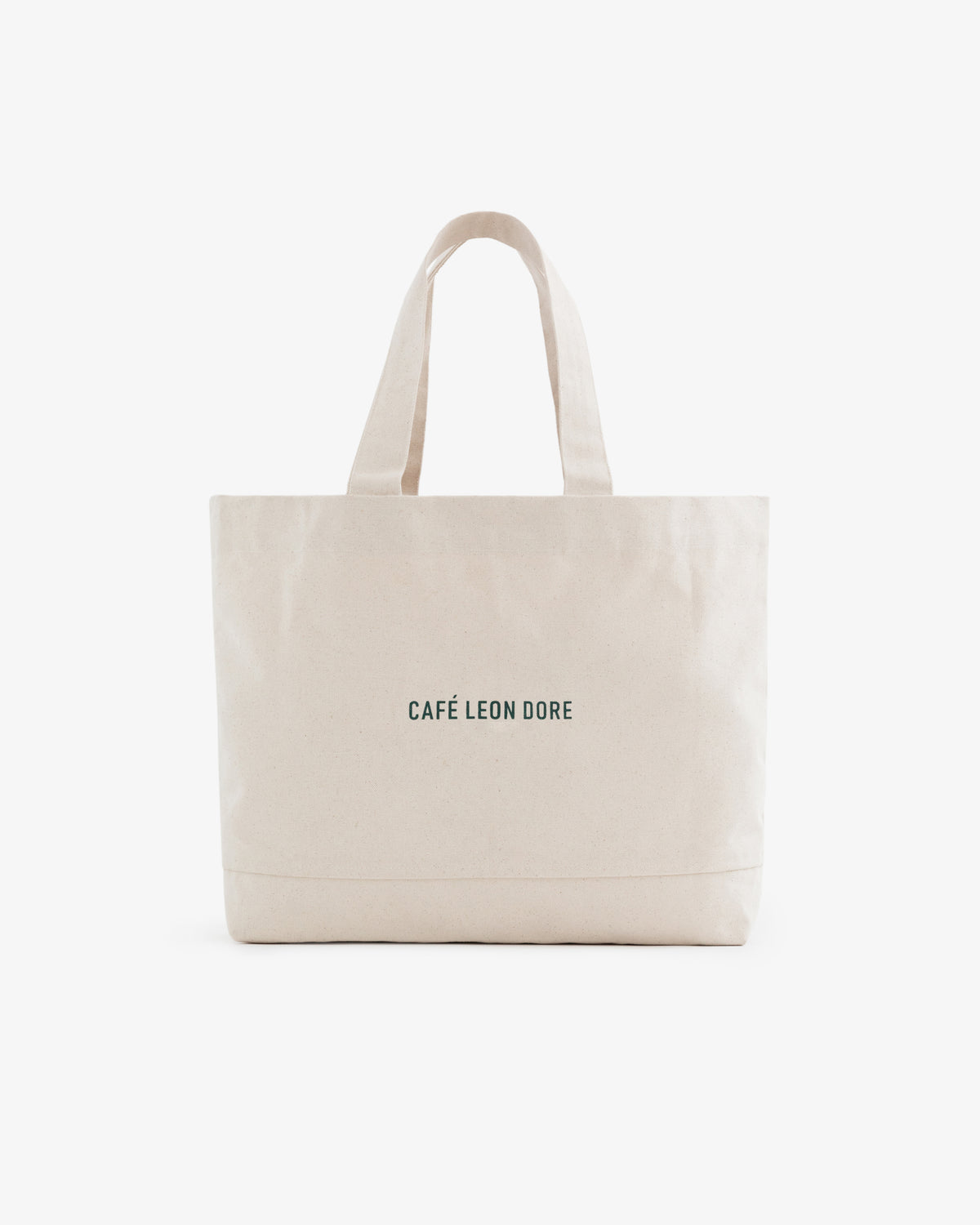Café Leon Dore Tote Bag: beige canvas with two handles and small black CAFÉ LEON DORE text on the front.