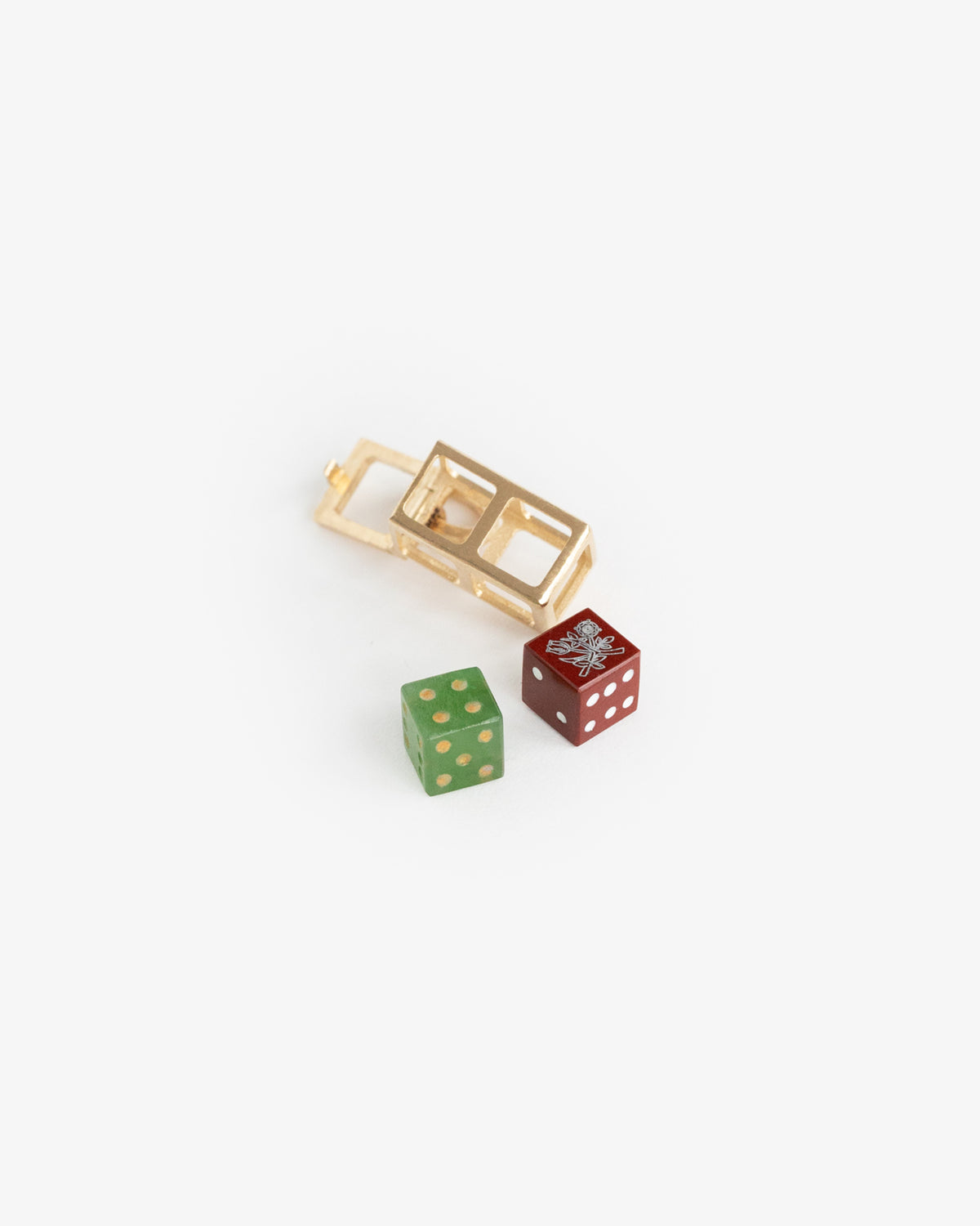 14Kt Gold Lucky Dice Pendant with green and red dice, each featuring a silver bug on a white background.