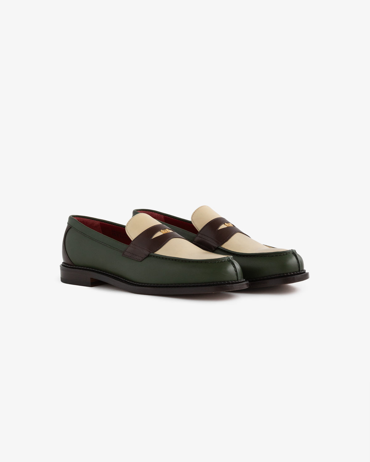 Queens Crest Loafer in green and beige with dark brown straps, low heels, red interiors on a white background.