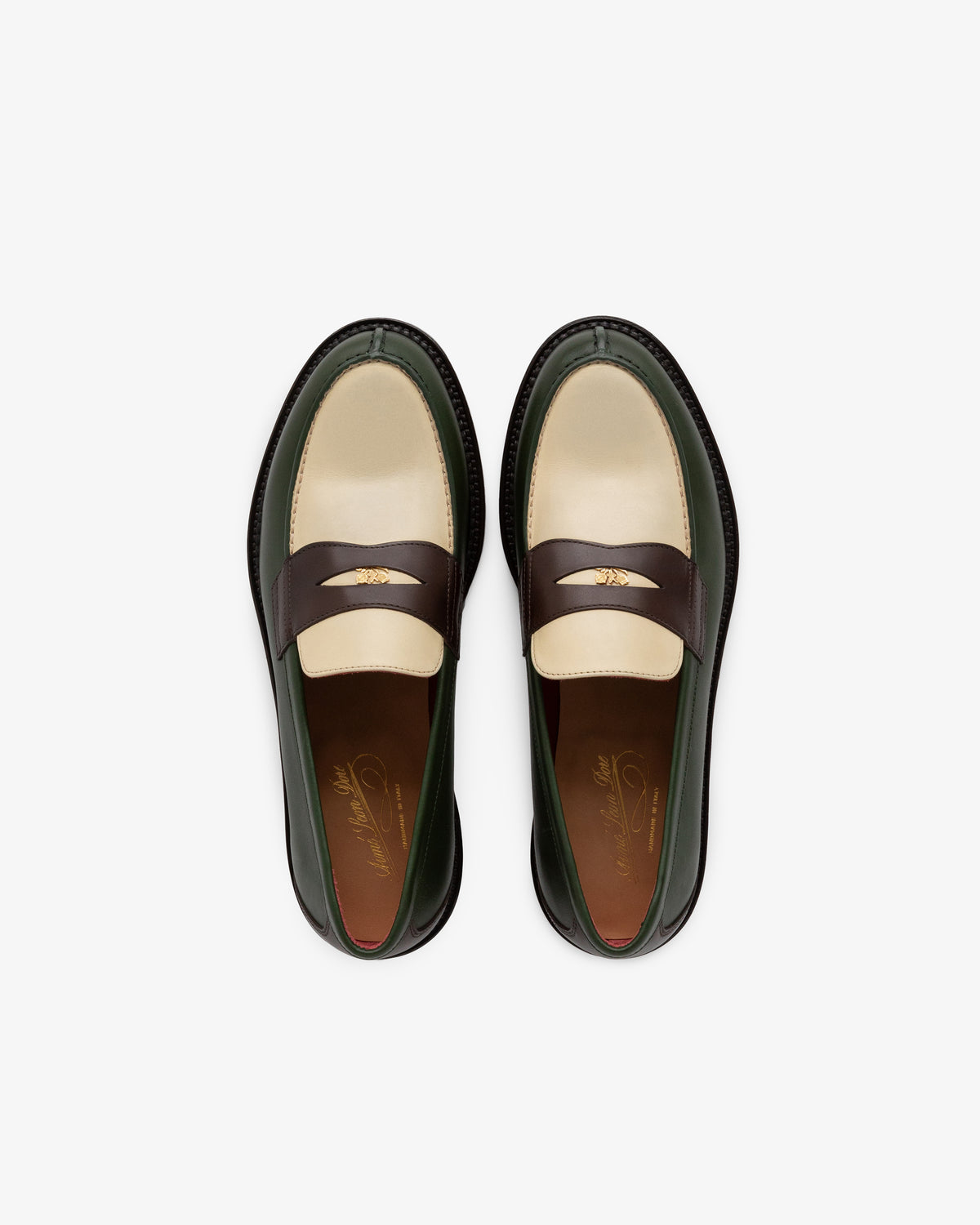 Queens Crest Loafer in cream, brown, and green leather with gold strap detail, top view.