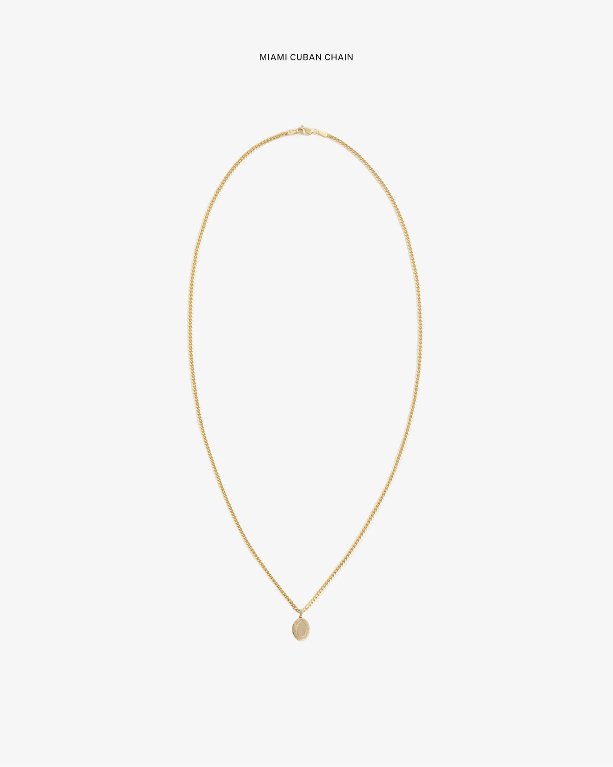 14Kt Gold Pendant on a Miami Cuban chain, shown against a plain white background.