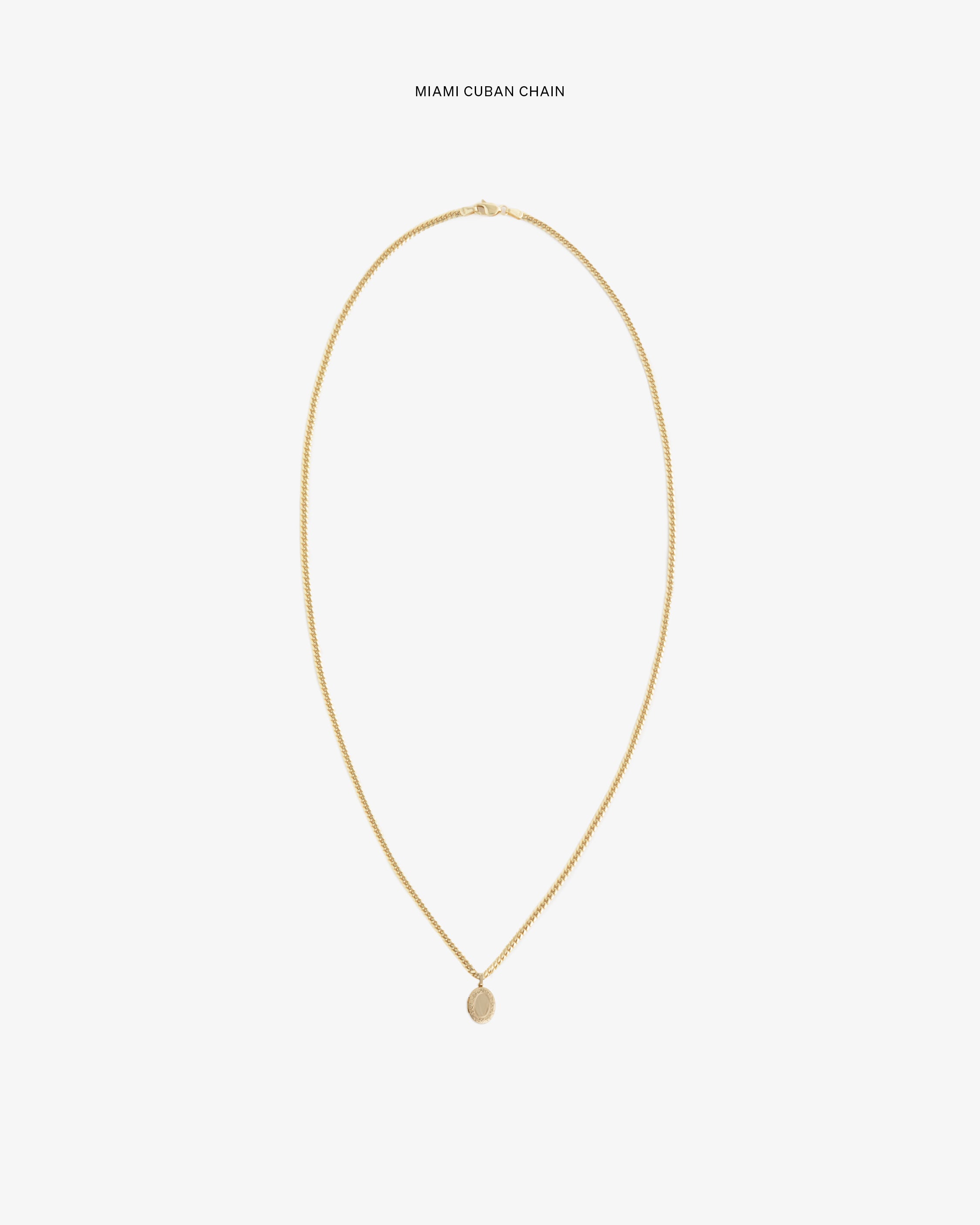 14Kt Gold Pendant on a Miami Cuban chain, shown against a plain white background.