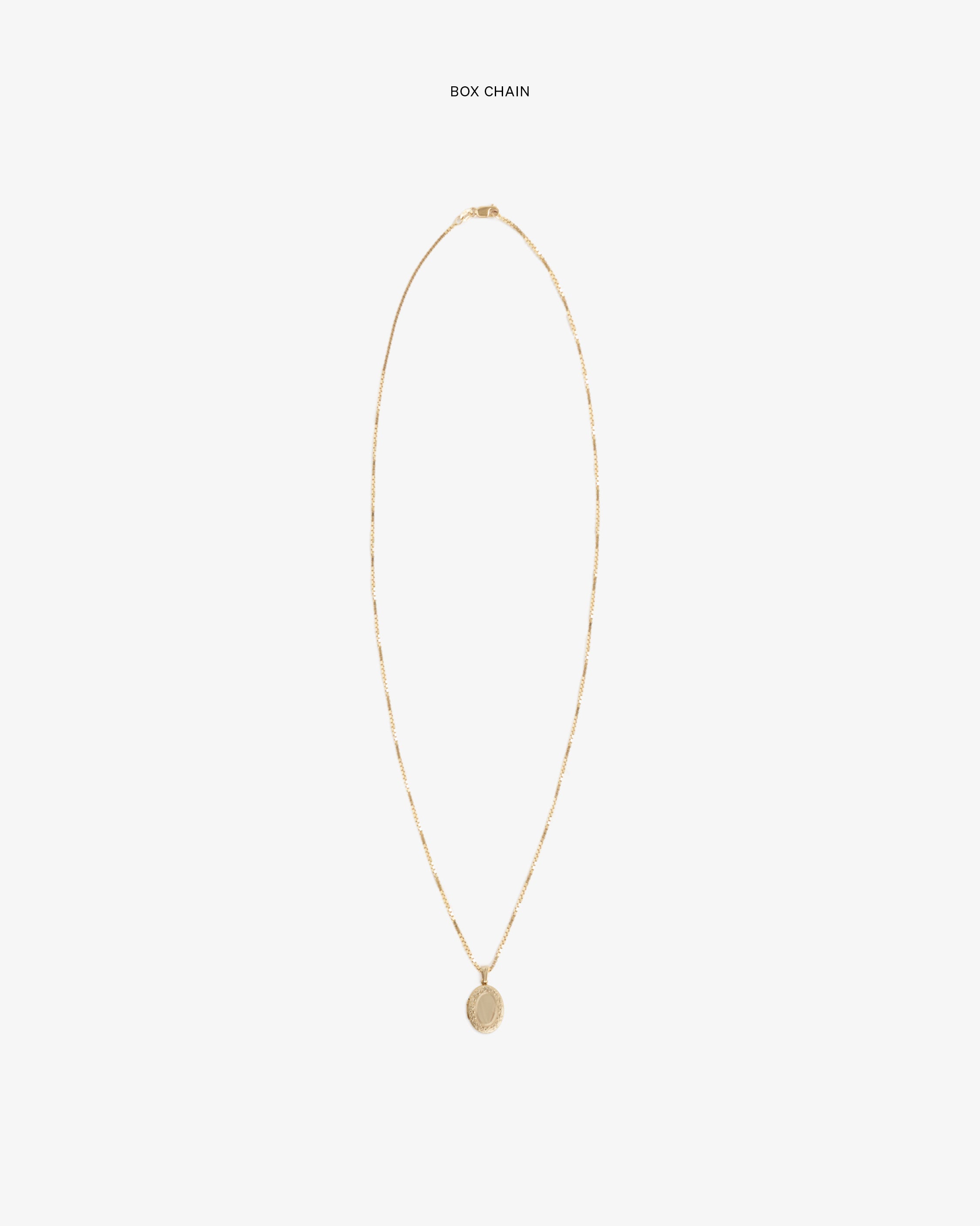 14Kt Gold Pendant on a box chain, shown against a plain white background.