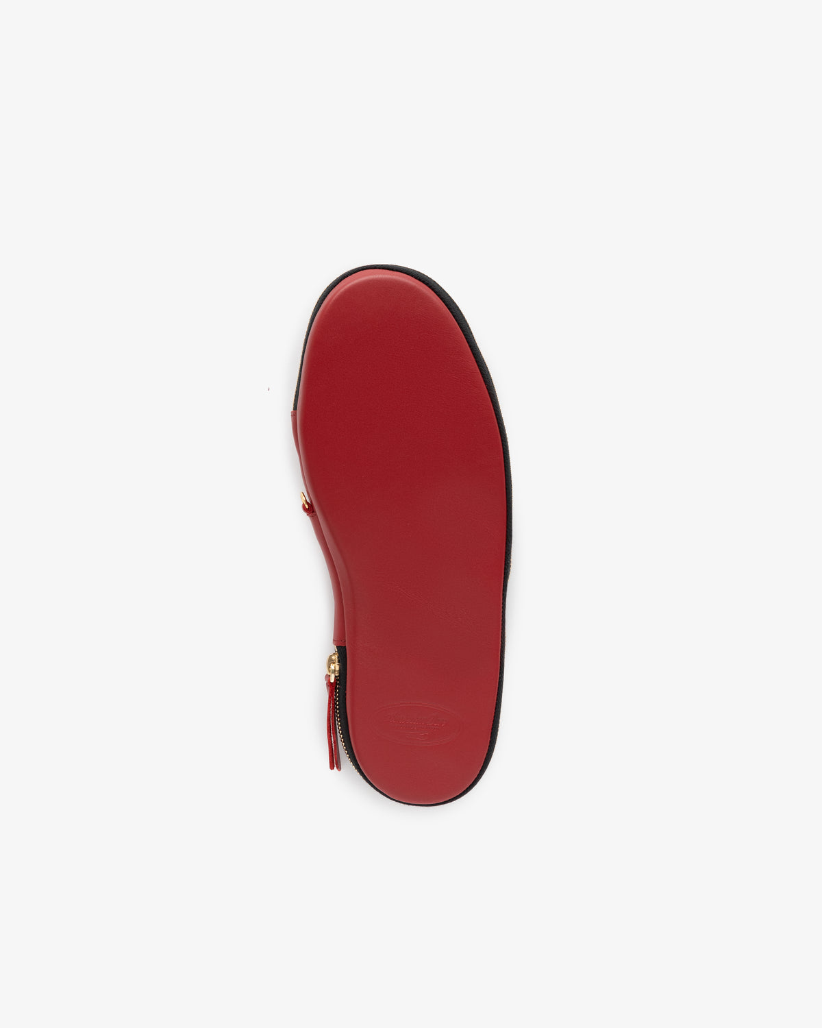 Leather Travel Slipper with a red sole and side zipper, viewed from the bottom on a white background.