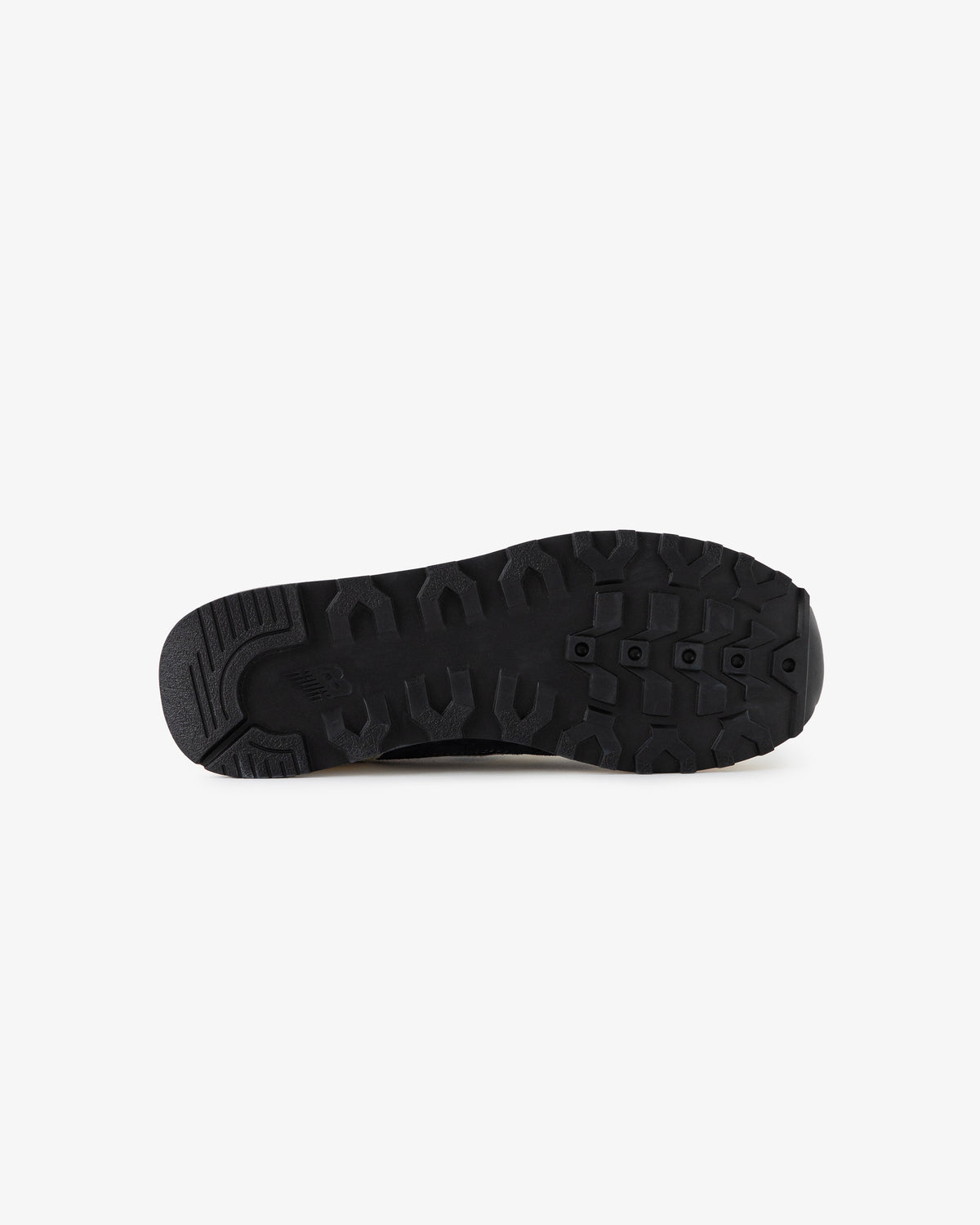 ALD / New Balance 475 black shoe sole with rugged tread, shown sole up on a white background.