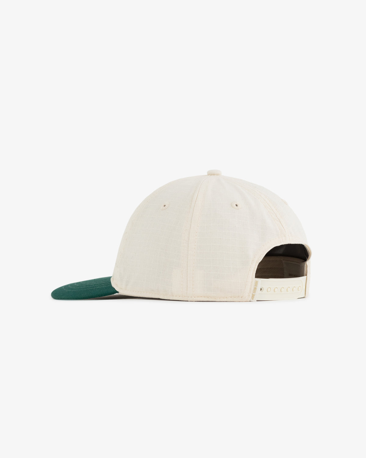 Unisphere Hat in beige with green brim, shown from the back with adjustable snap closure.