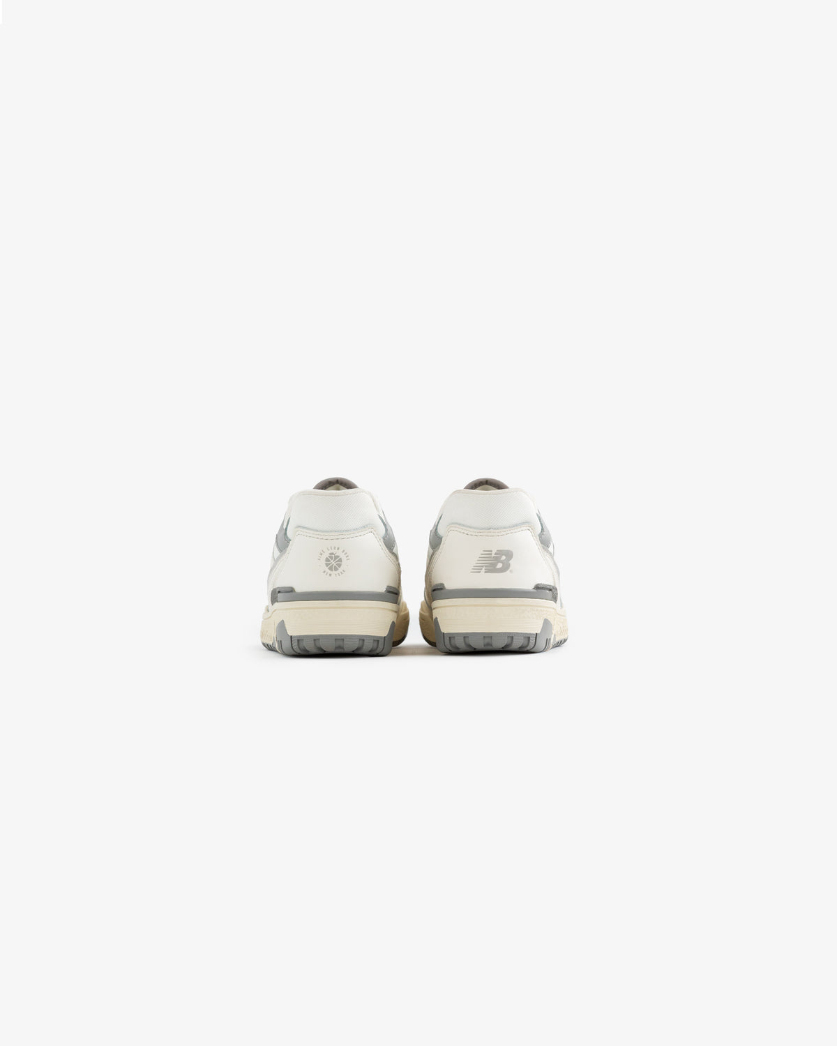 Back view of ALD / NB P550 Basketball Oxfords - Little Kids in white and gray against a plain white background.
