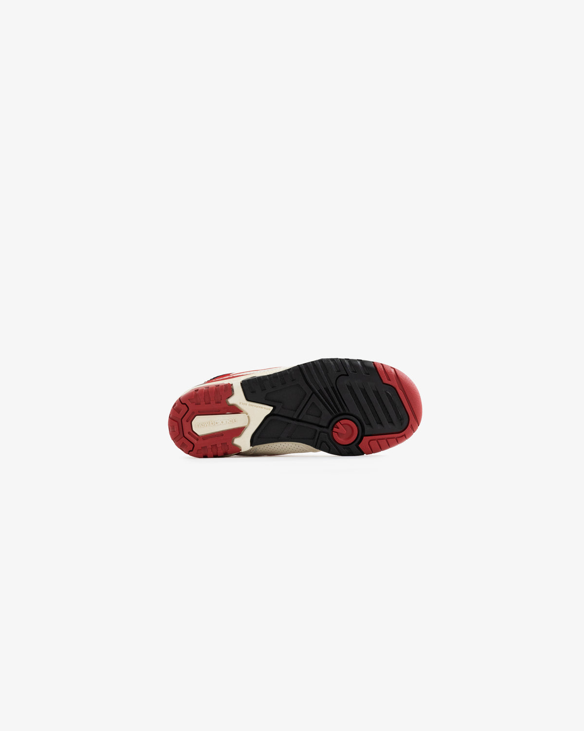 The bottom view of ALD / NB P550 Basketball Oxfords - Little Kids with a black, red, and beige rubber sole.