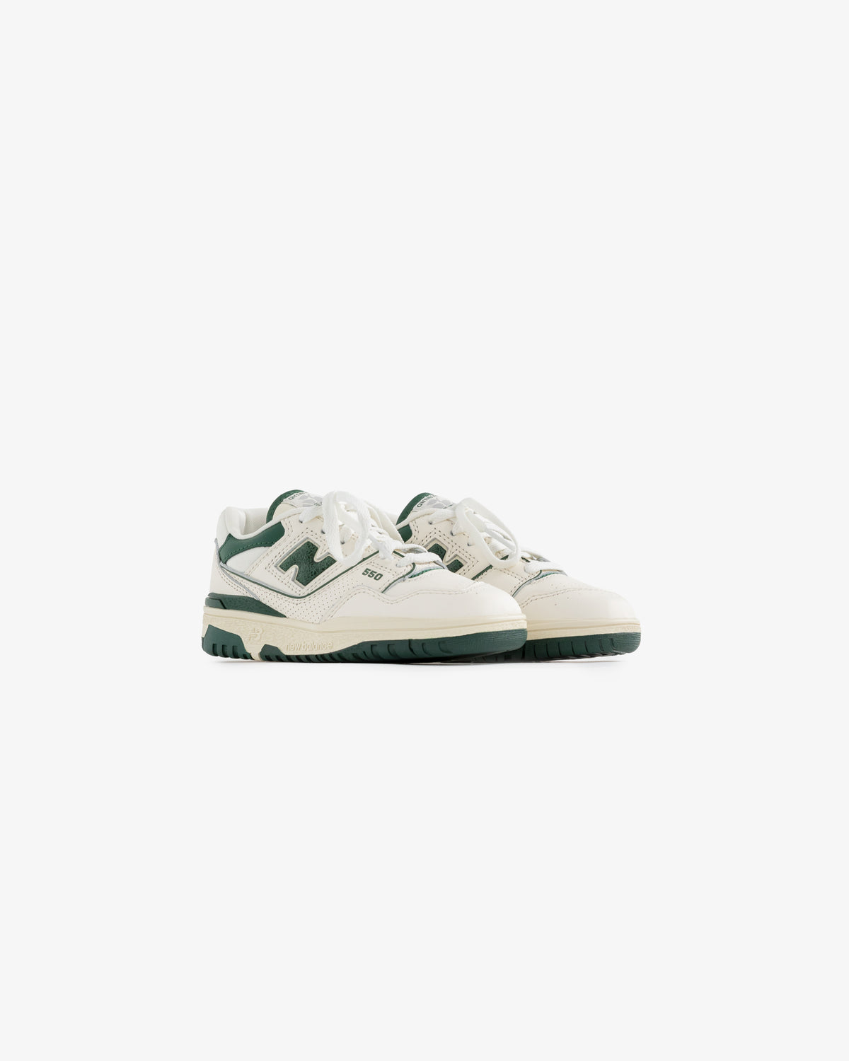 ALD / NB P550 Basketball Oxfords - Little Kids in white and green with laces on a plain white background.