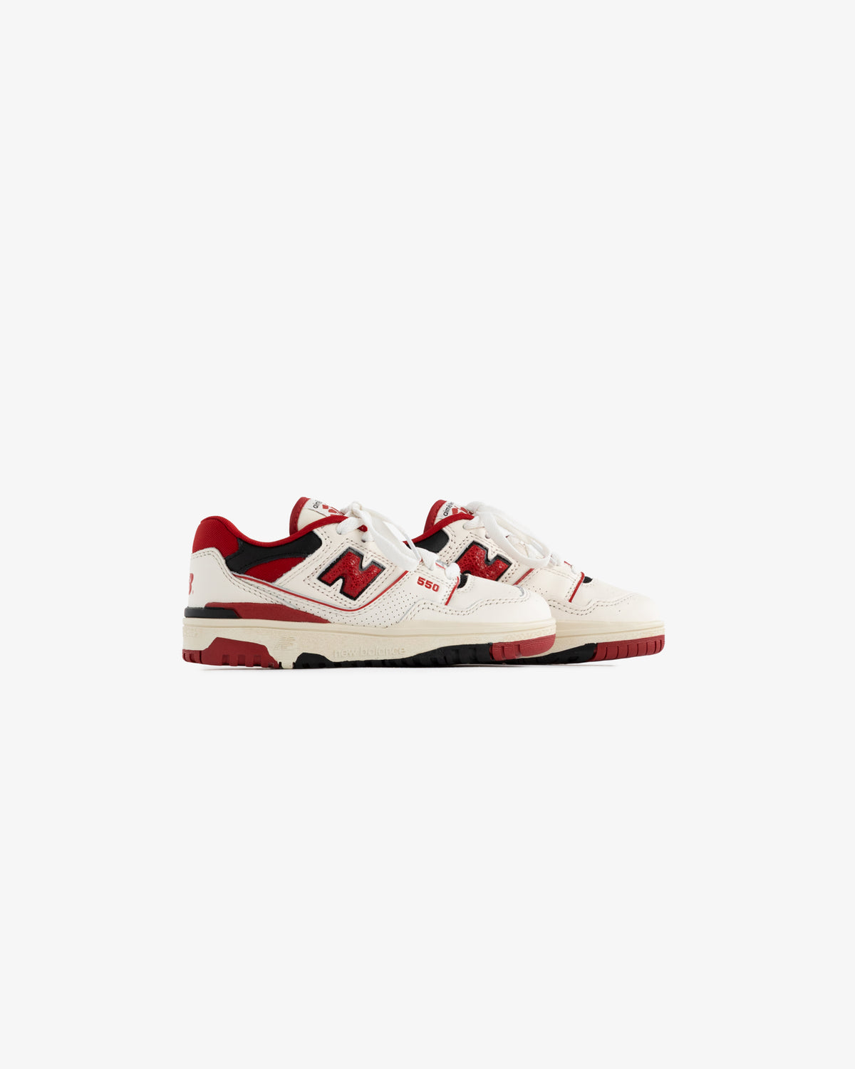 ALD / NB P550 Basketball Oxfords for little kids in white and red with black accents, side view on white background.