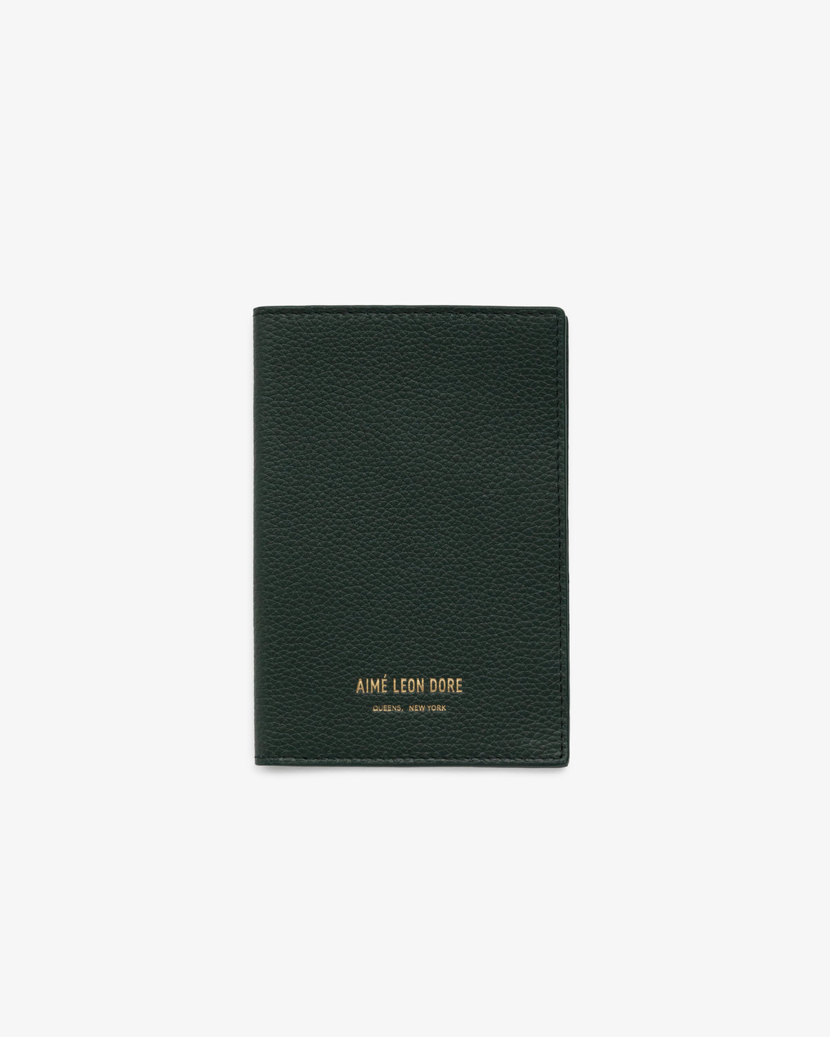 A dark green Leather Passport Holder with gold AIMÉ LEON DORE text at the bottom center.