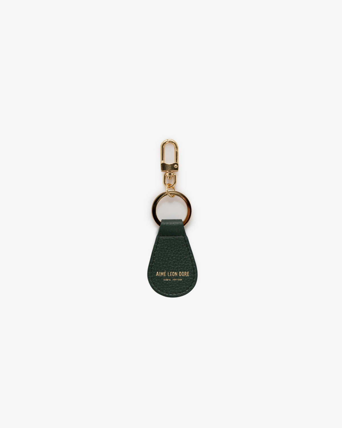 Dark green Leather Key Fob with gold hardware and AIME LEON DORE embossed at the bottom.