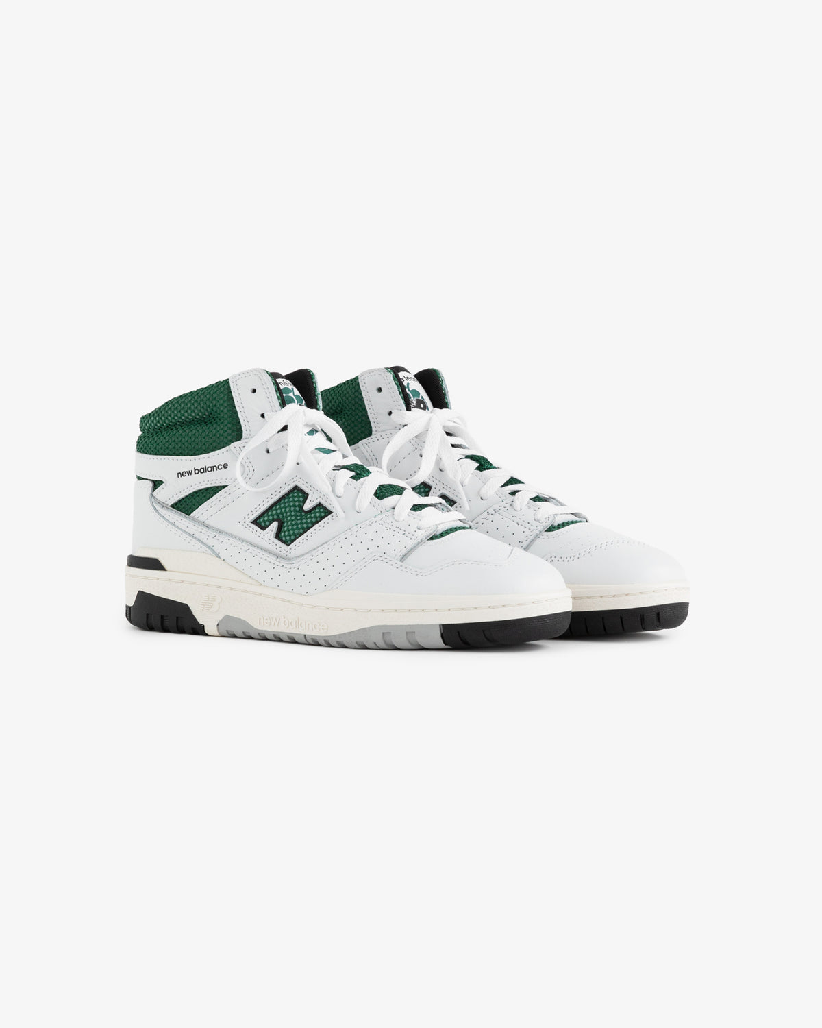 A pair of ALD / New Balance 650R white and green high-top sneakers with laces on a white background.