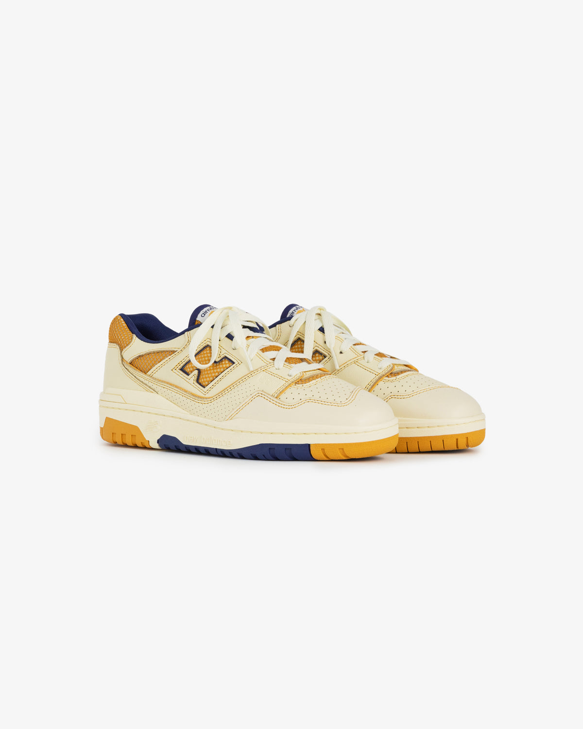 Cream, yellow, and navy ALD / NB P550 Basketball Oxfords with chunky sole, mesh panels, and lace-up design.