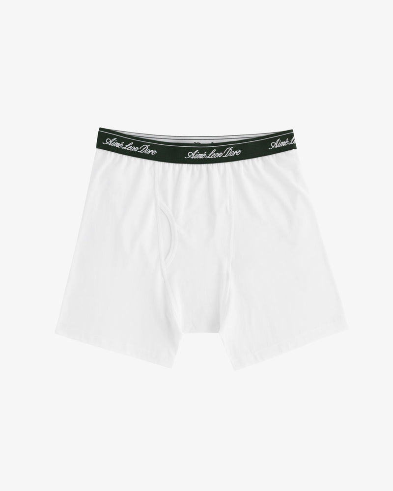 Boxer Brief 3-Pack: White briefs with black waistbands and white cursive text on a plain, light background.