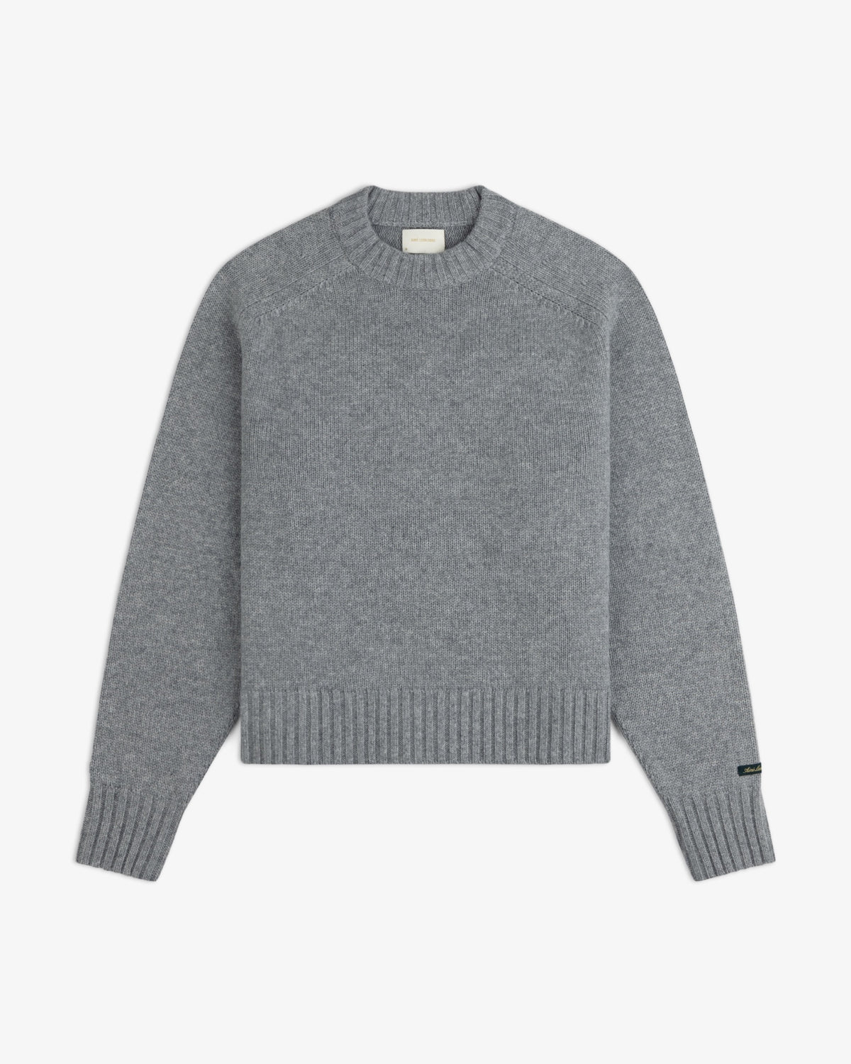 Grey Cashmere Crewneck Sweater with long sleeves and ribbed cuffs and hem.