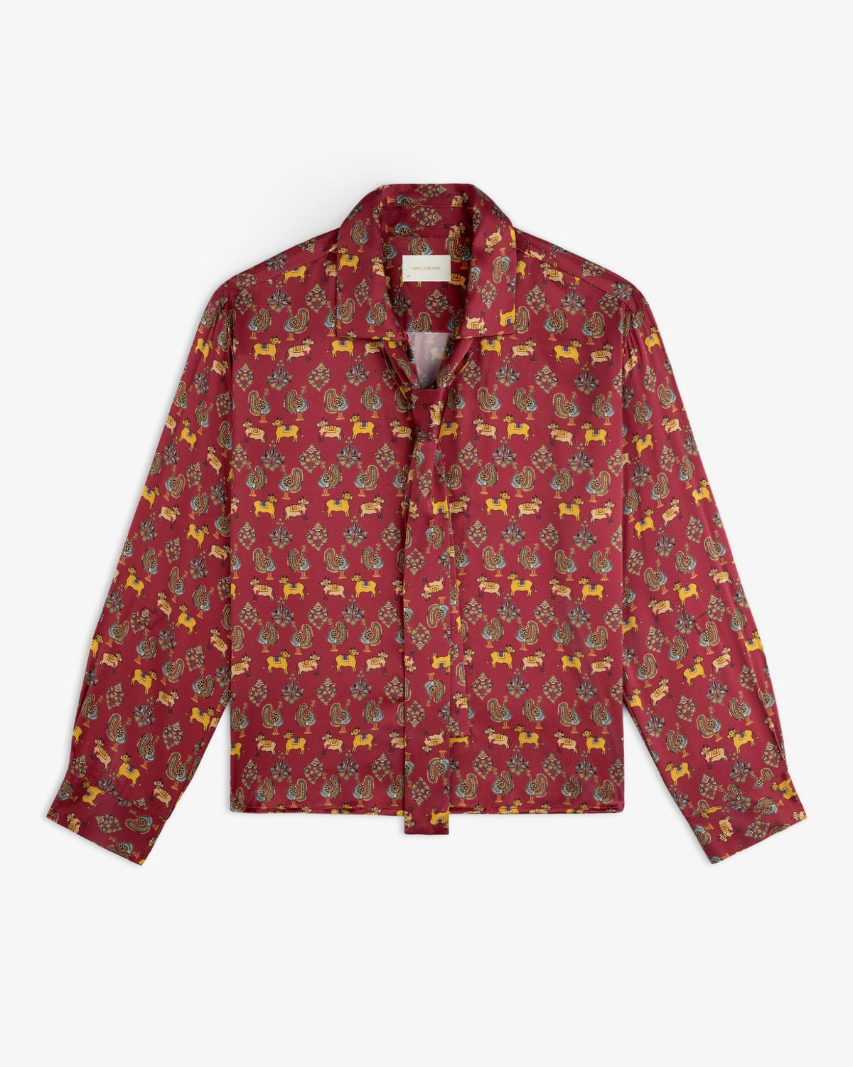 Archival Print Silk Tie Neck Blouse in deep red with a repeating pattern of small animals and floral motifs.
