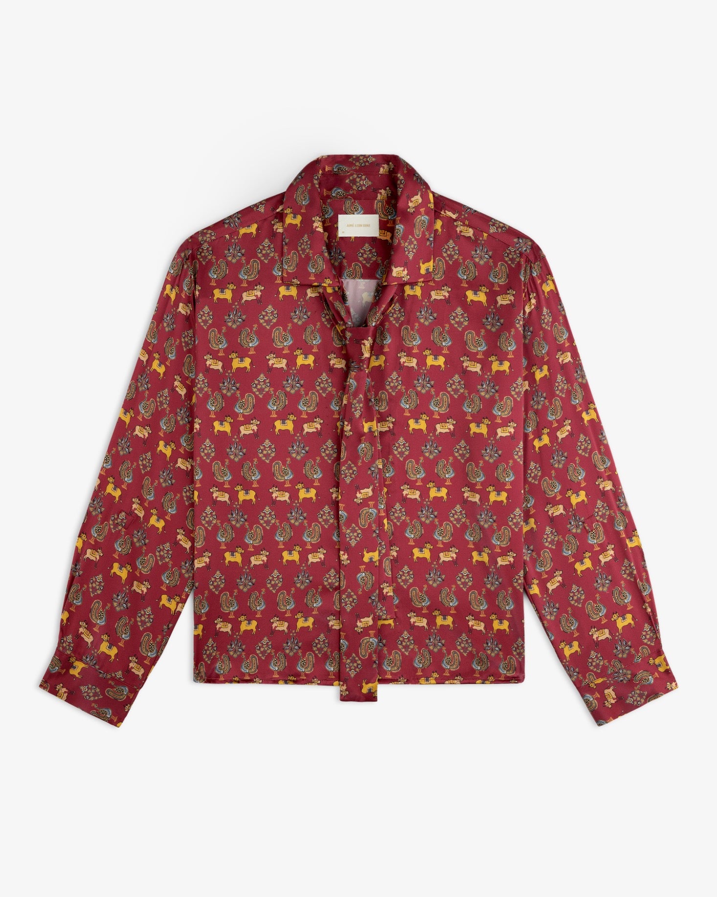 Archival Print Silk Tie Neck Blouse in deep red with a repeating pattern of small animals and floral motifs.