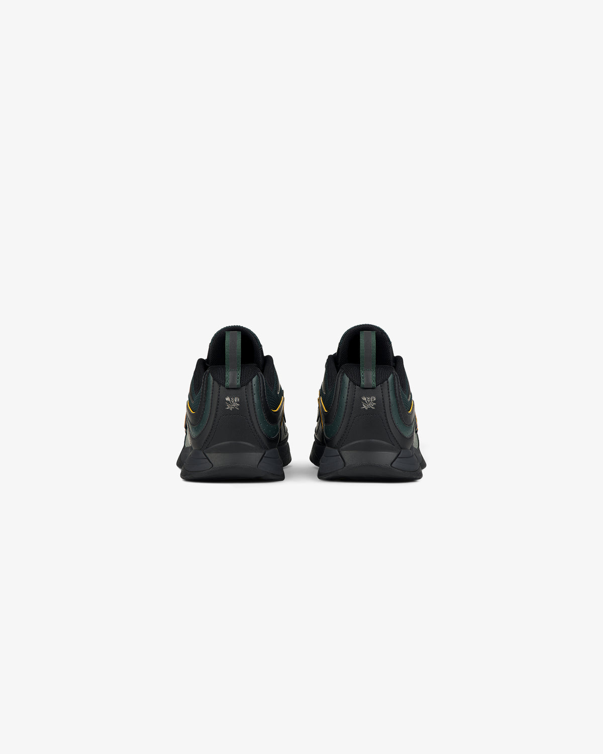 Back view of ALD / New Balance RC56 black sneakers with green accents and heel logo, on a white background.