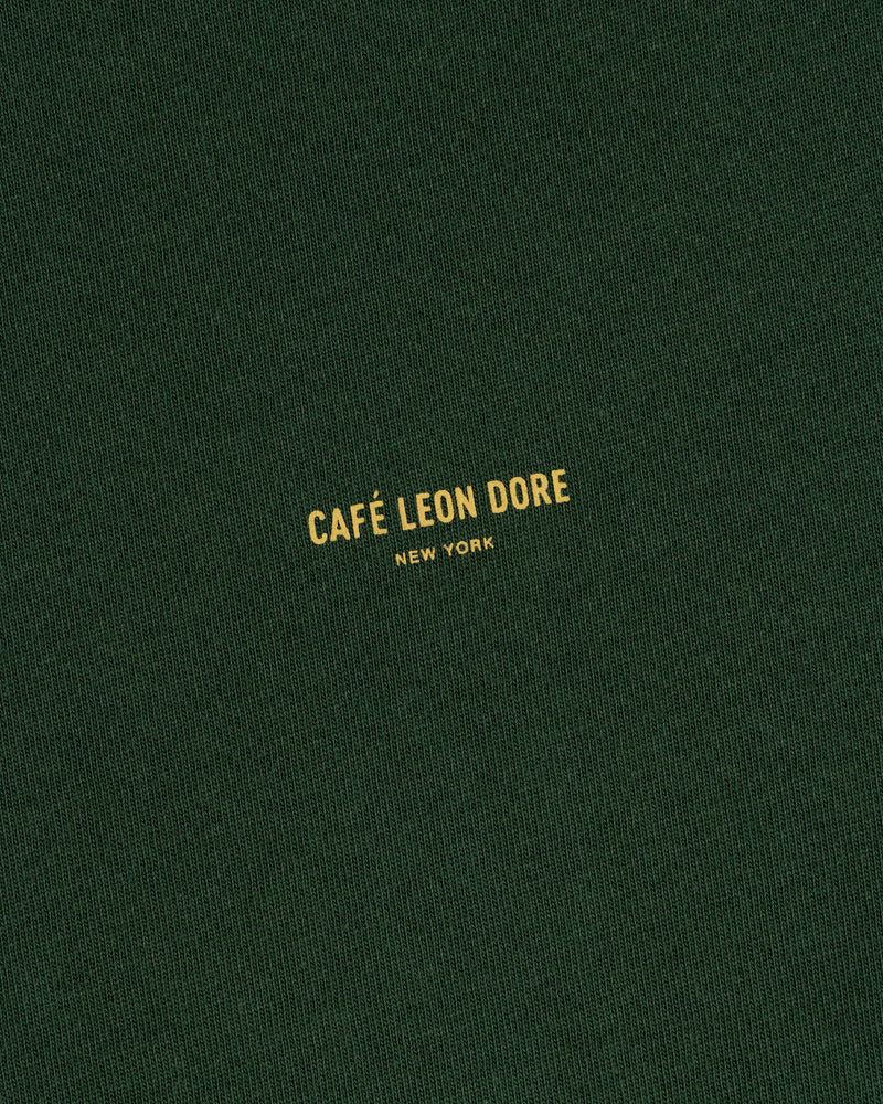 Dark green Café Leon Dore Logo Tee with small yellow “CAFÉ LEON DORE NEW YORK” printed at the center.