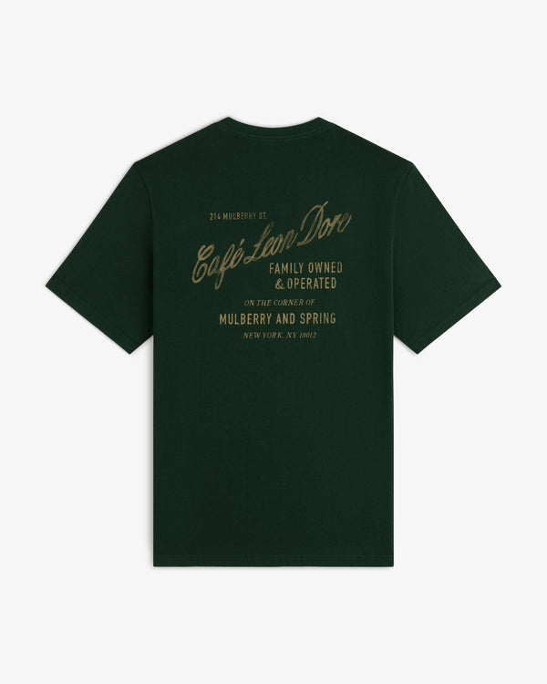 Café Leon Dore Mulberry Tee: dark green with gold “Café Leon Dore, Family Owned & Operated, Mulberry and Spring”.