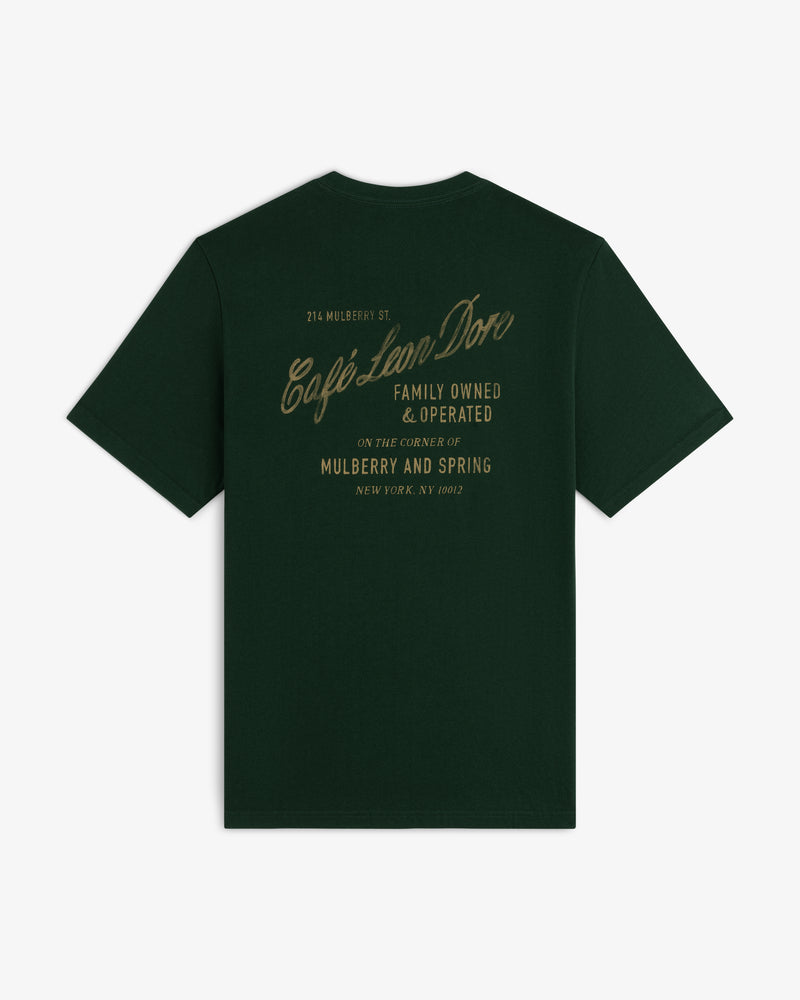 Café Leon Dore Mulberry Tee: dark green with gold “Café Leon Dore, Family Owned & Operated, Mulberry and Spring”.