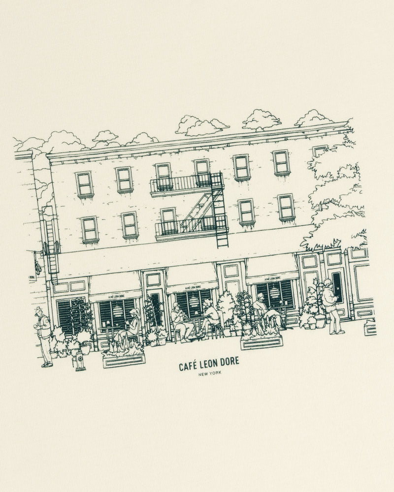 Line drawing of café with people outside; text reads Café Leon Dore New York. Café Leon Dore Storefront Tee.