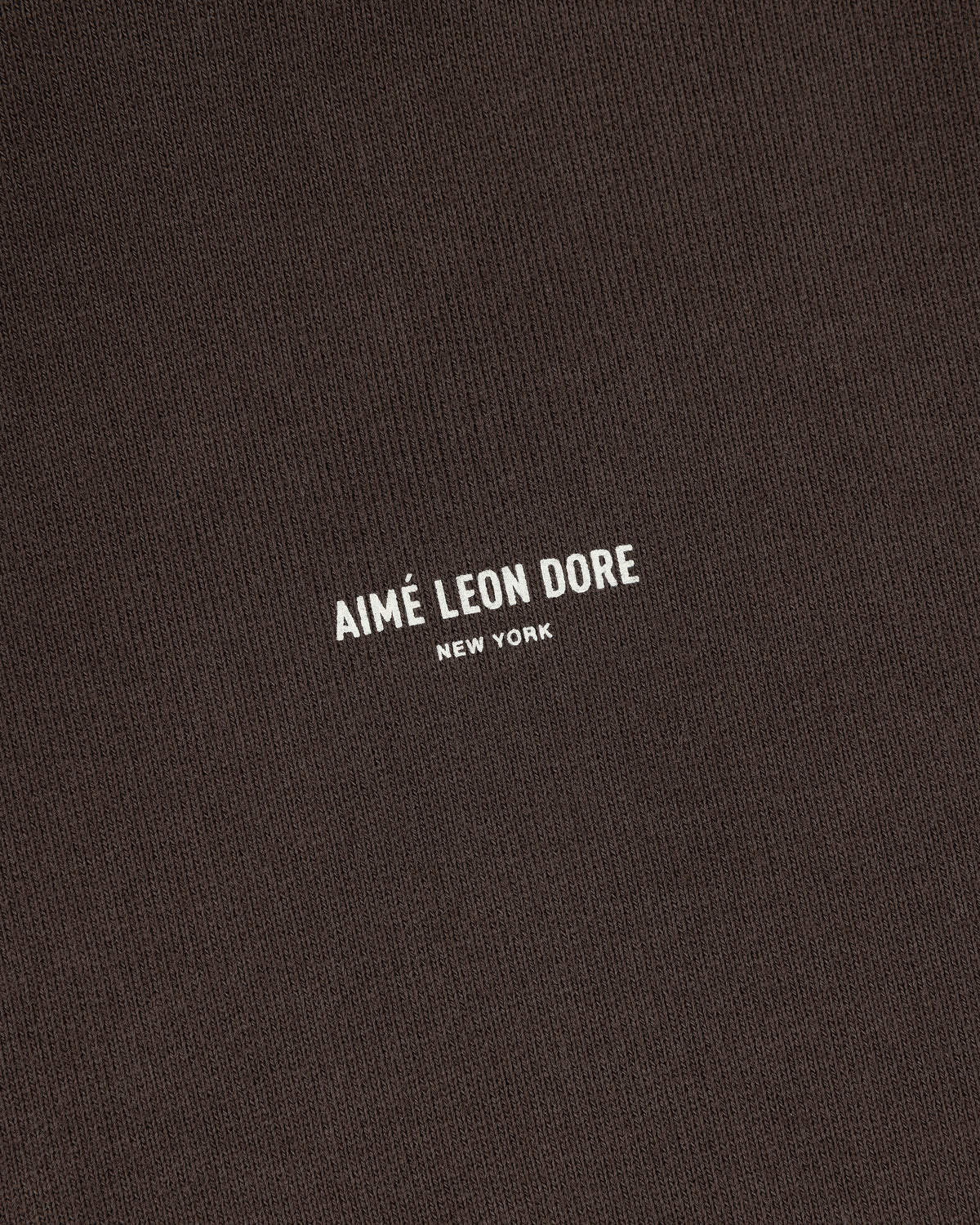 Brown Micro Logo Hoodie with small white "Aimé Leon Dore New York." text in the center.