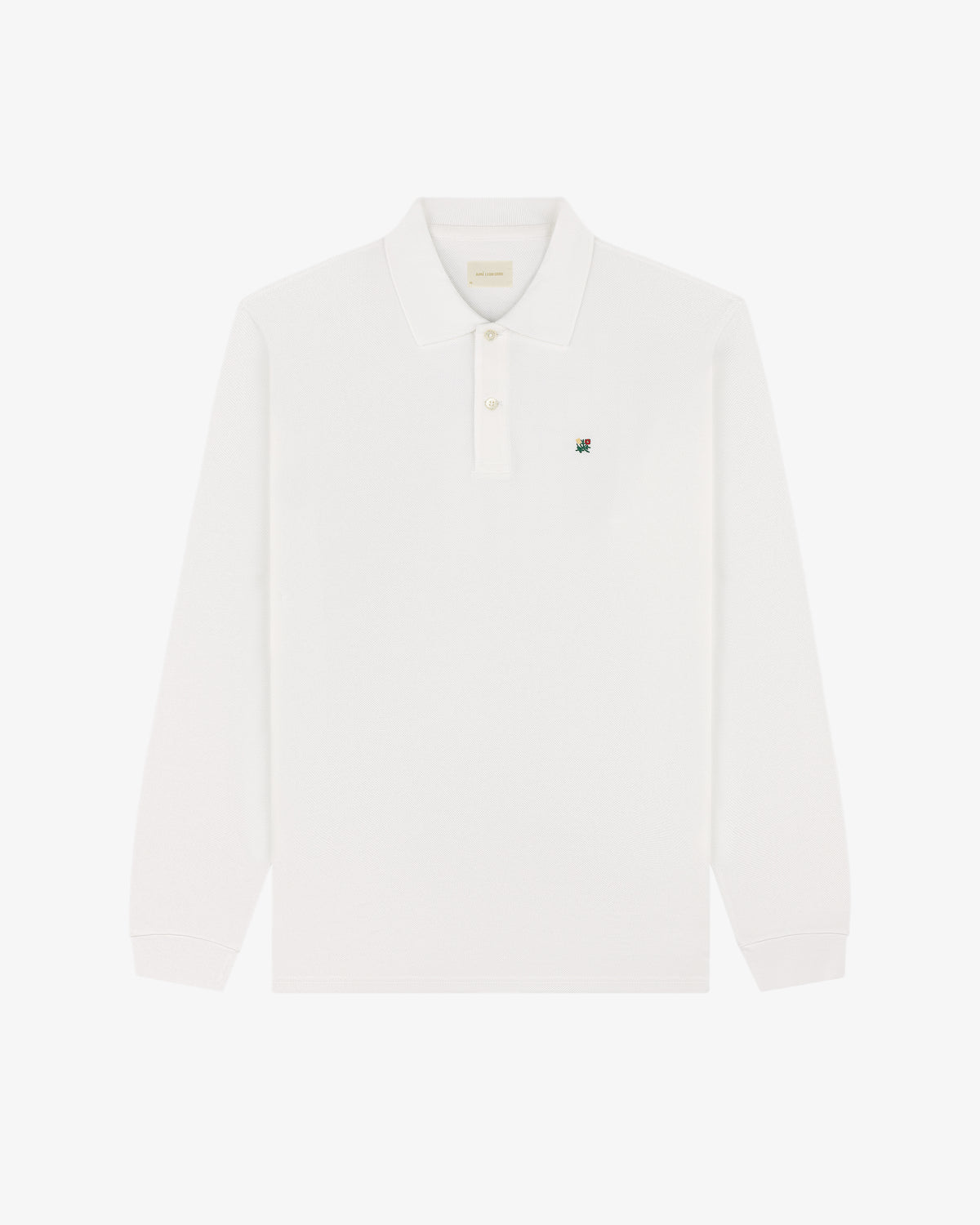 Long-Sleeve Crest Piqué Polo featuring a collar, buttons, and a small embroidered logo on the left chest.