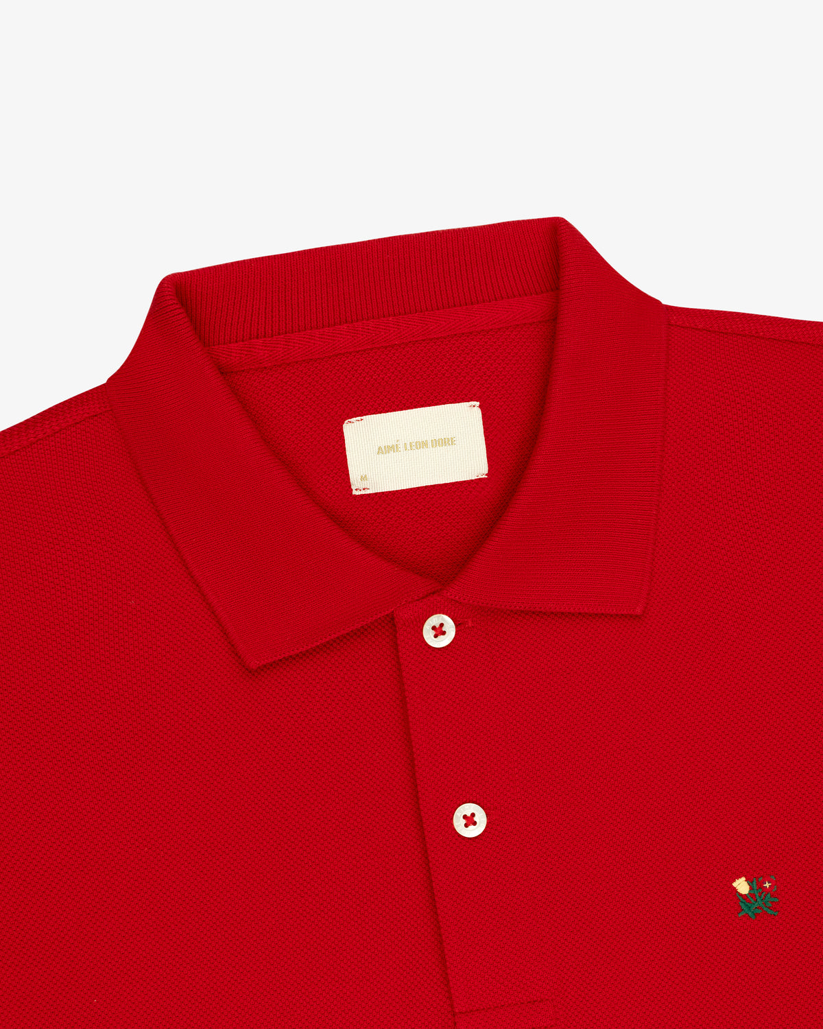 Long-Sleeve Crest Piqué Polo: red, collared, two buttons, bird crest logo embroidered on chest.