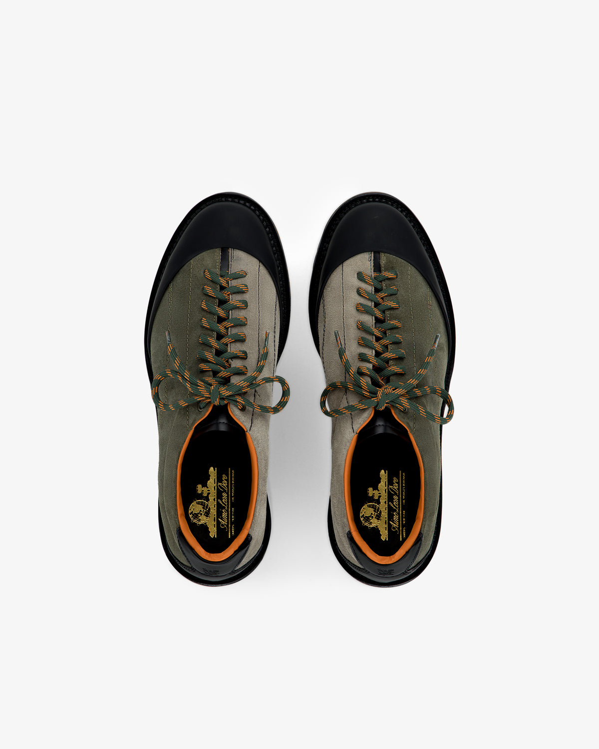 Top view of Suede Derby Hiker sneakers in green with black toe caps and orange accents on a white background.