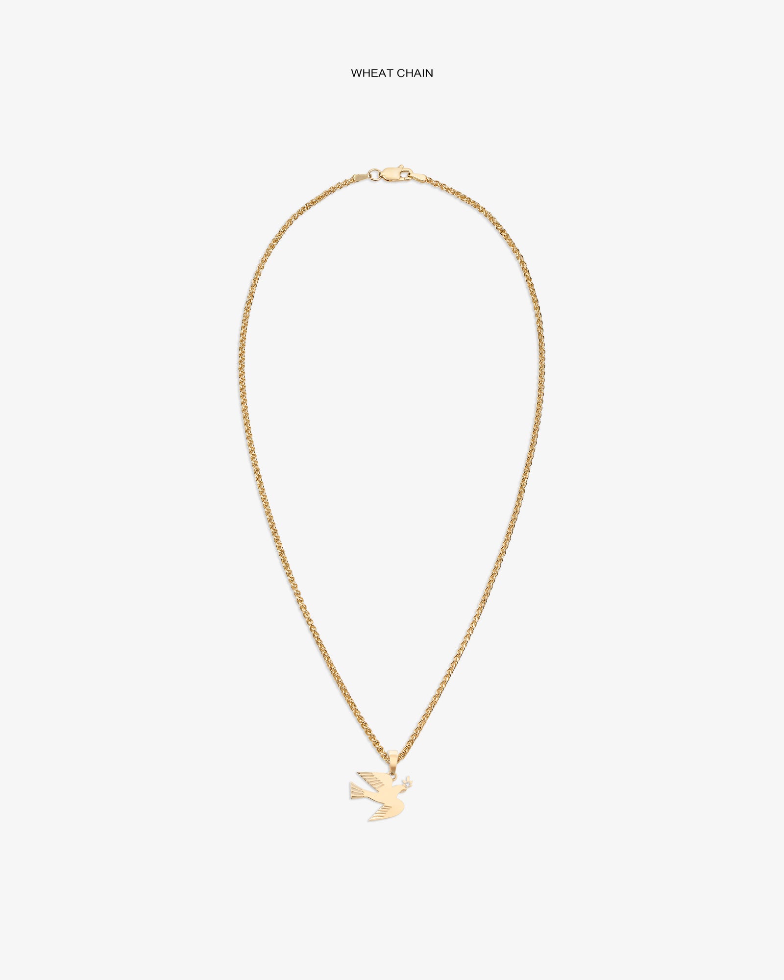 14Kt gold dove pendant displayed on a wheat chain against a white background.