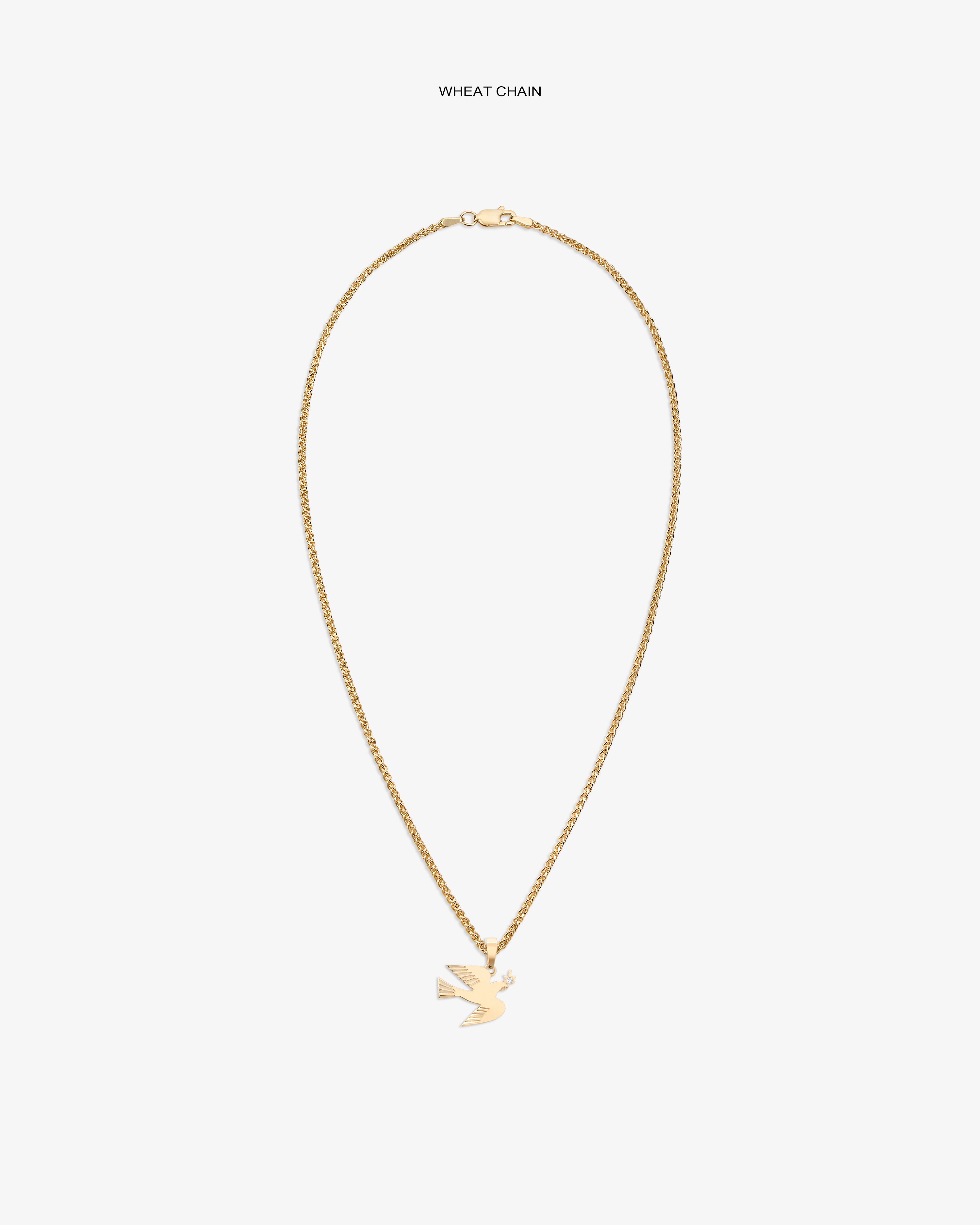 14Kt gold dove pendant displayed on a wheat chain against a white background.