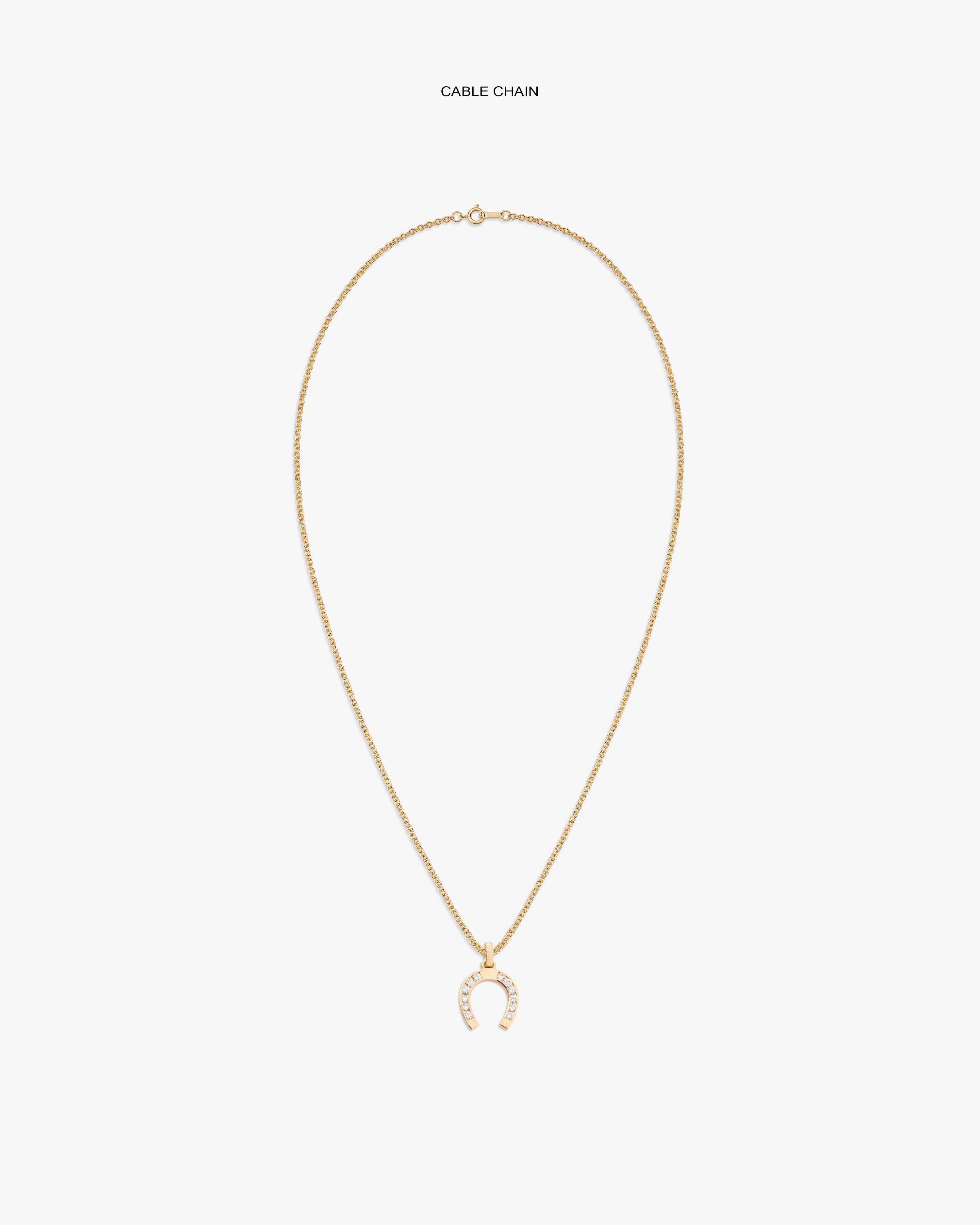 Diamond Horseshoe Pendant on a gold chain, featuring small white stones, displayed on a white background.
