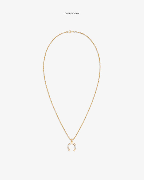 Diamond Horseshoe Pendant on a gold chain, featuring small white stones, displayed on a white background.