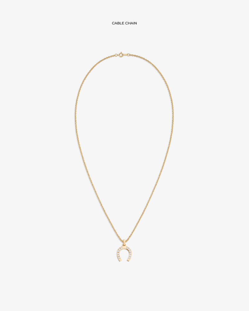 Diamond Horseshoe Pendant on a gold chain, featuring small white stones, displayed on a white background.