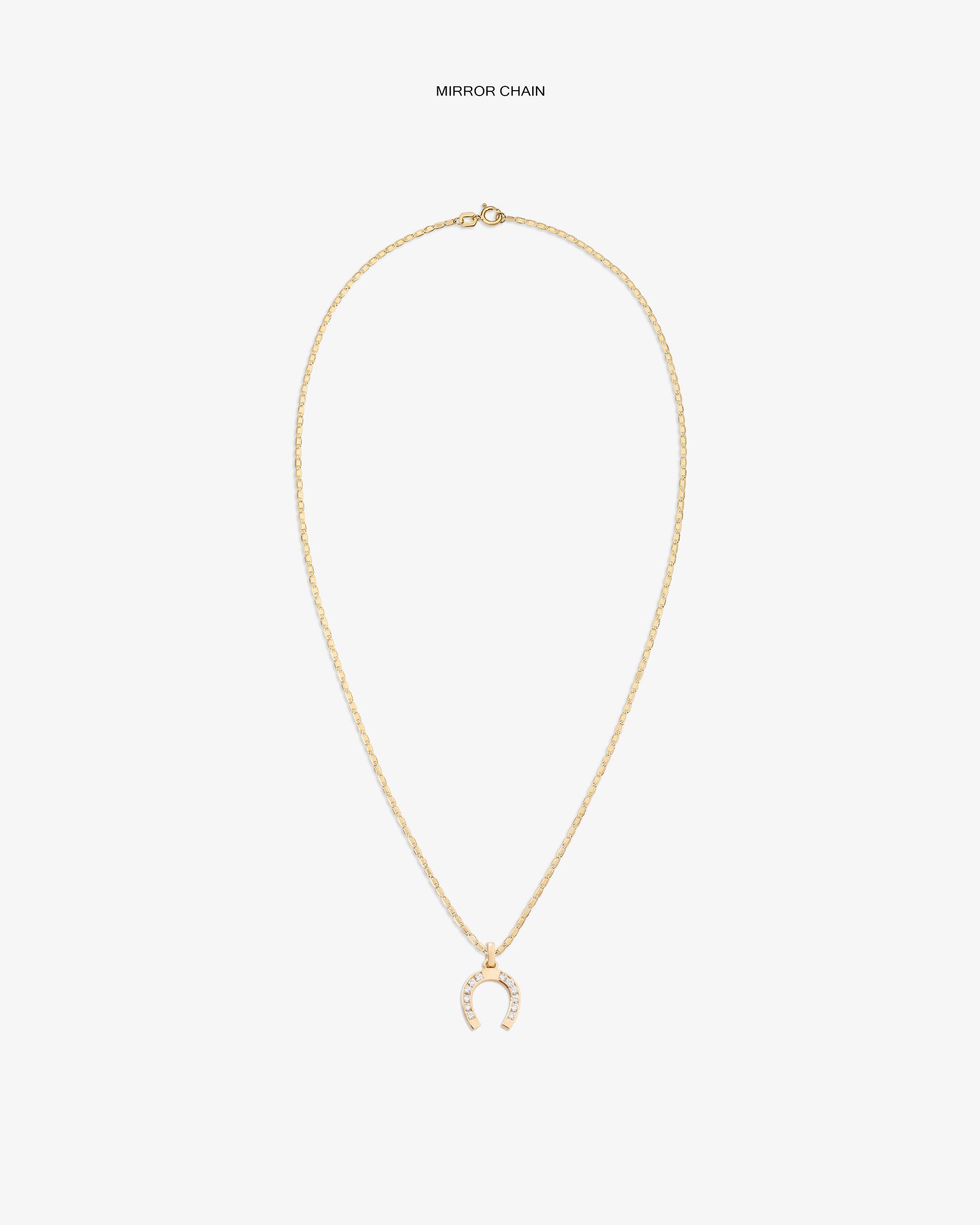 Diamond Horseshoe Pendant: Gold necklace with delicate chain and a pavé horseshoe pendant, shown on white background.