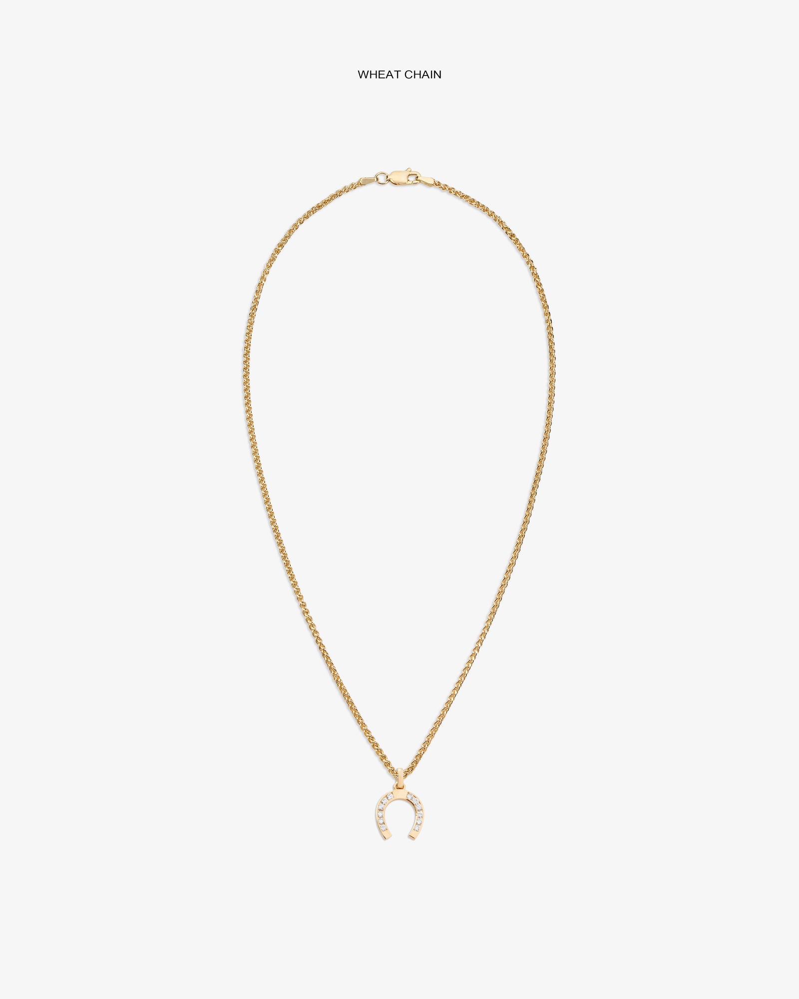 Diamond Horseshoe Pendant on gold wheat chain, shown on white background with sparkling clear stones.