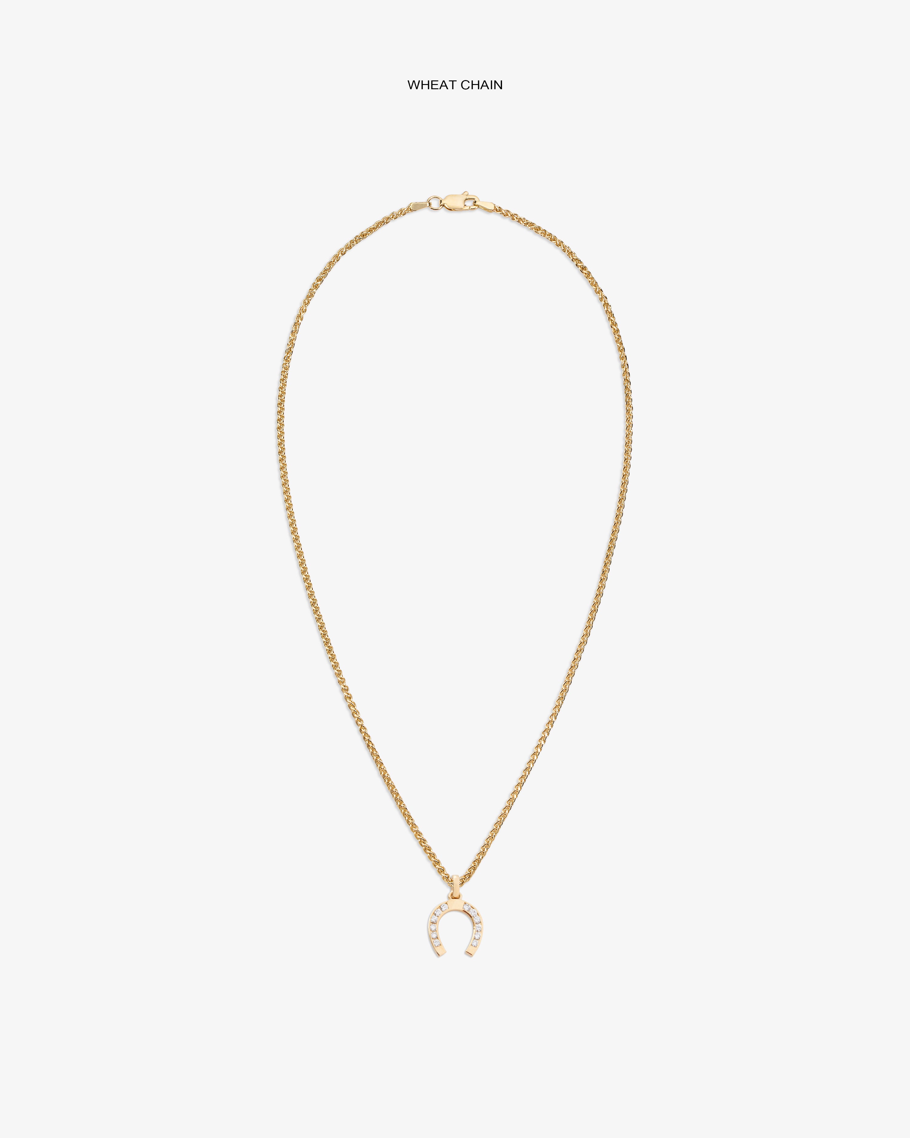 Diamond Horseshoe Pendant on gold wheat chain, shown on white background with sparkling clear stones.