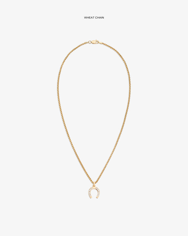 Diamond Horseshoe Pendant on gold wheat chain, shown on white background with sparkling clear stones.