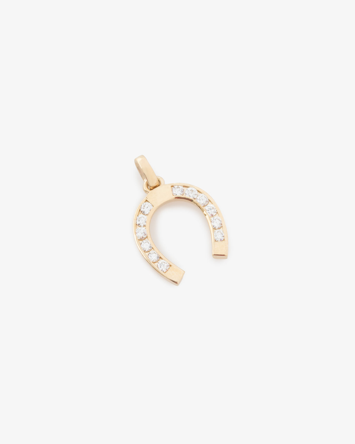 Diamond Horseshoe Pendant featuring small clear gems along the bottom curve, shown on a plain white background.