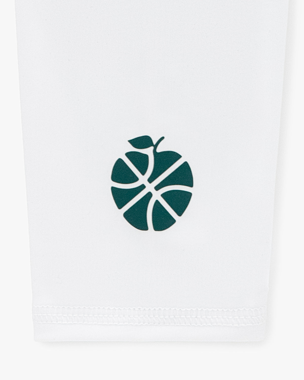A green apple-basketball logo on white fabric decorates the ALD / New Balance SONNY NY Calf Sleeves.