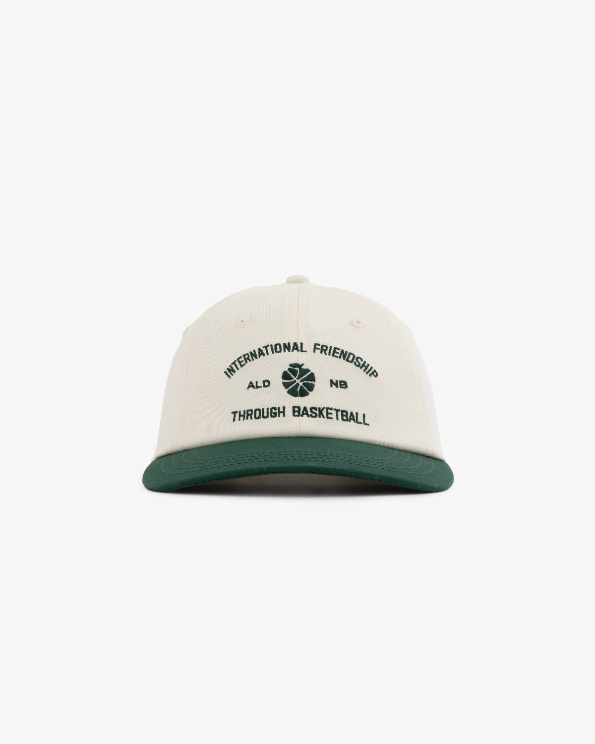 ALD/New Balance SONNY NY IFTB Hat: cream and green cap with “International Friendship Through Basketball” on front.
