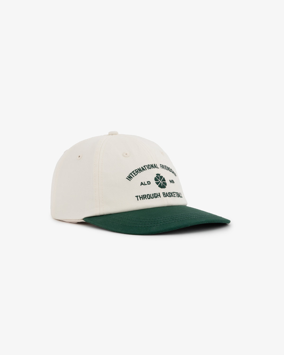 The ALD / New Balance SONNY NY IFTB Hat is a cream cap with a dark green brim and black front text and graphics.